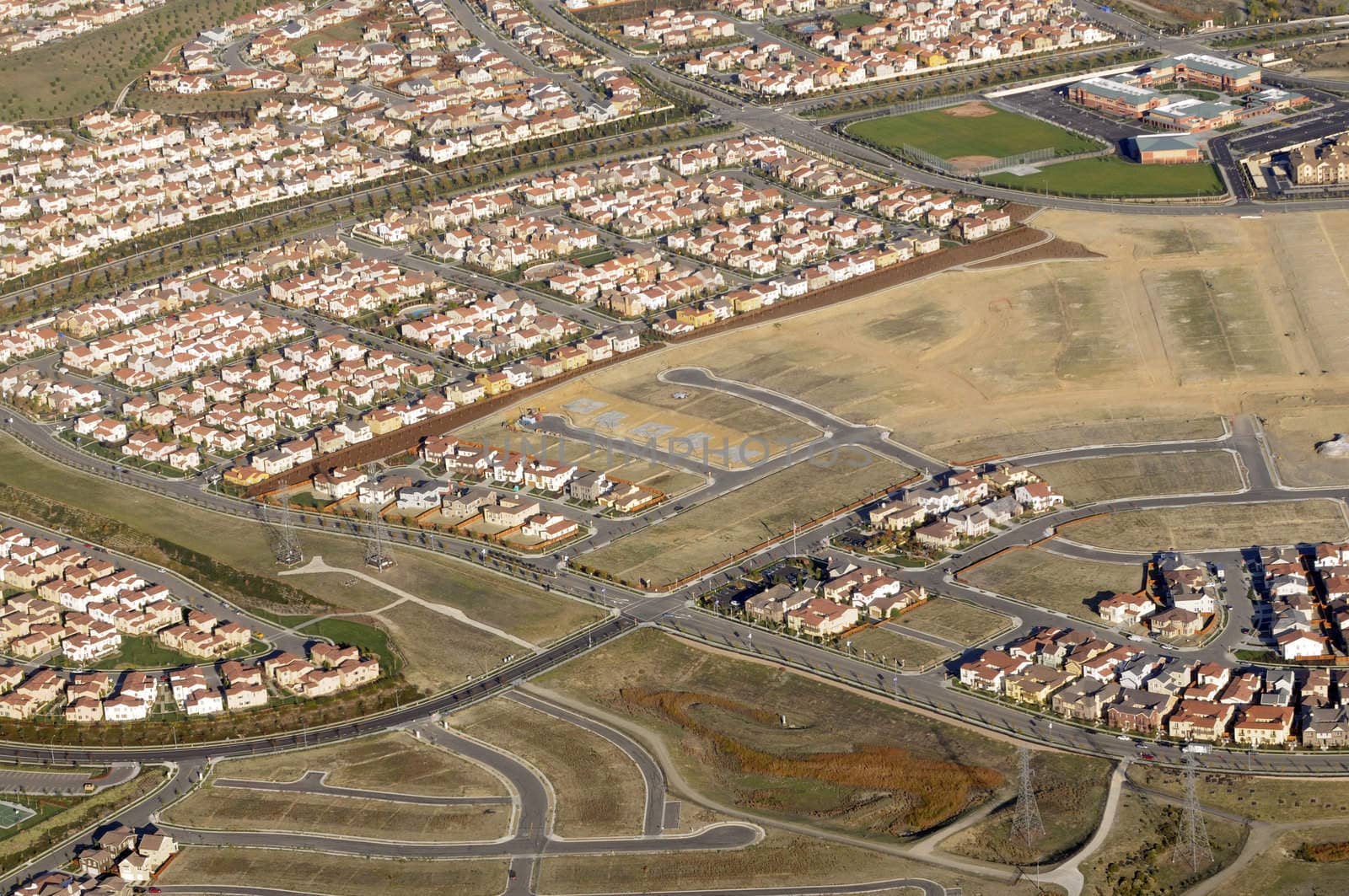Modern Housing development with unfinished lots from the air