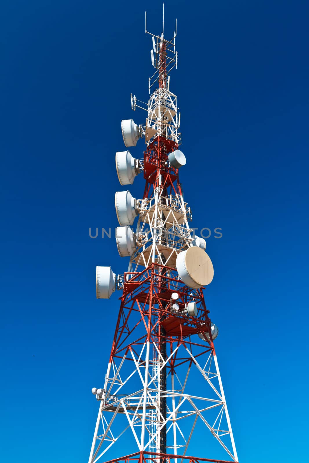 Communications tower with a beautiful blue sky