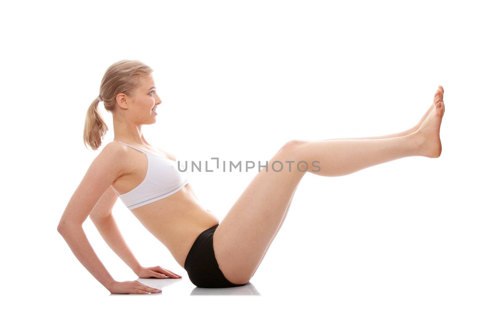 Young woman doing yoga exercise, isolated on white background