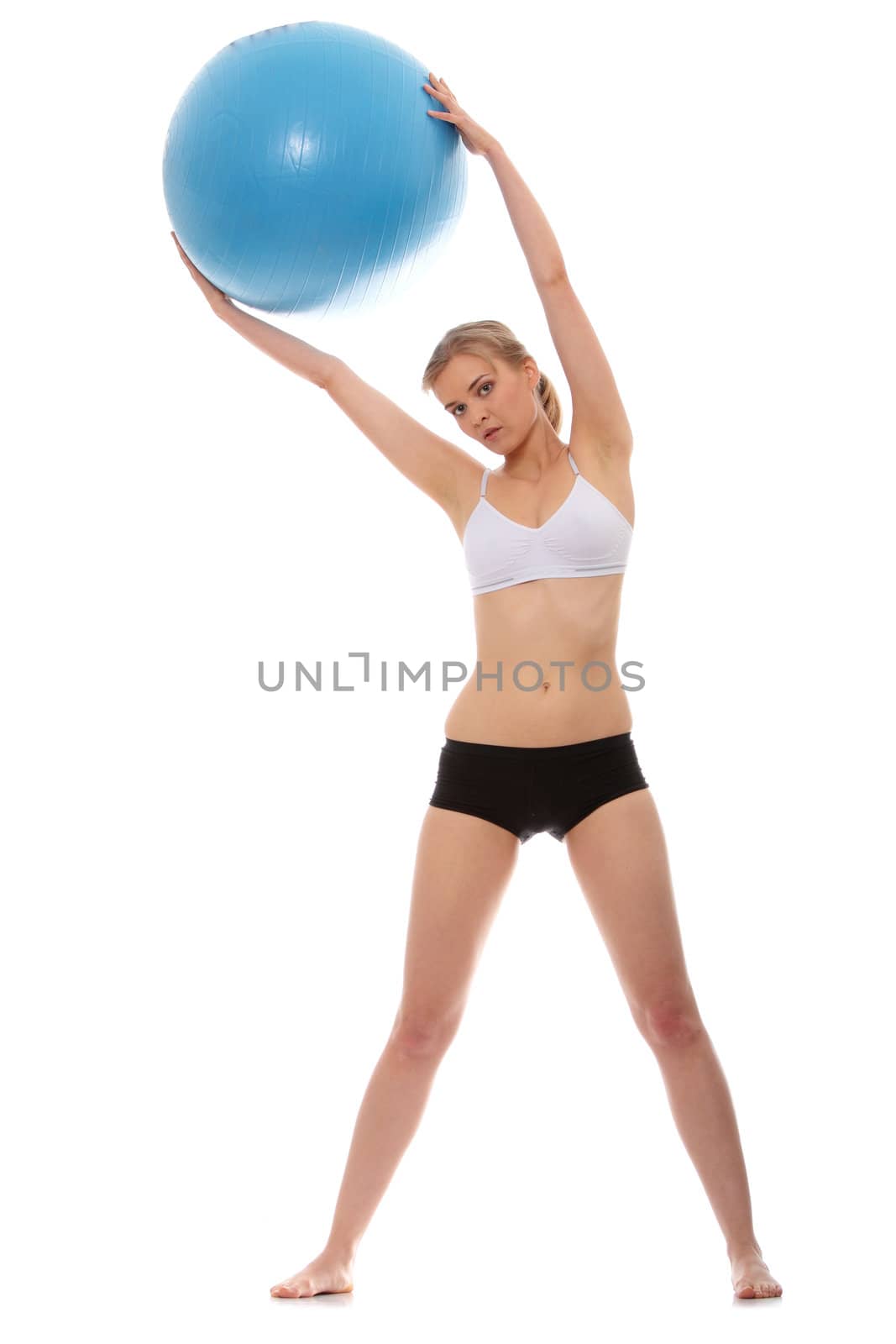 Woman exercising with fitness ball by BDS