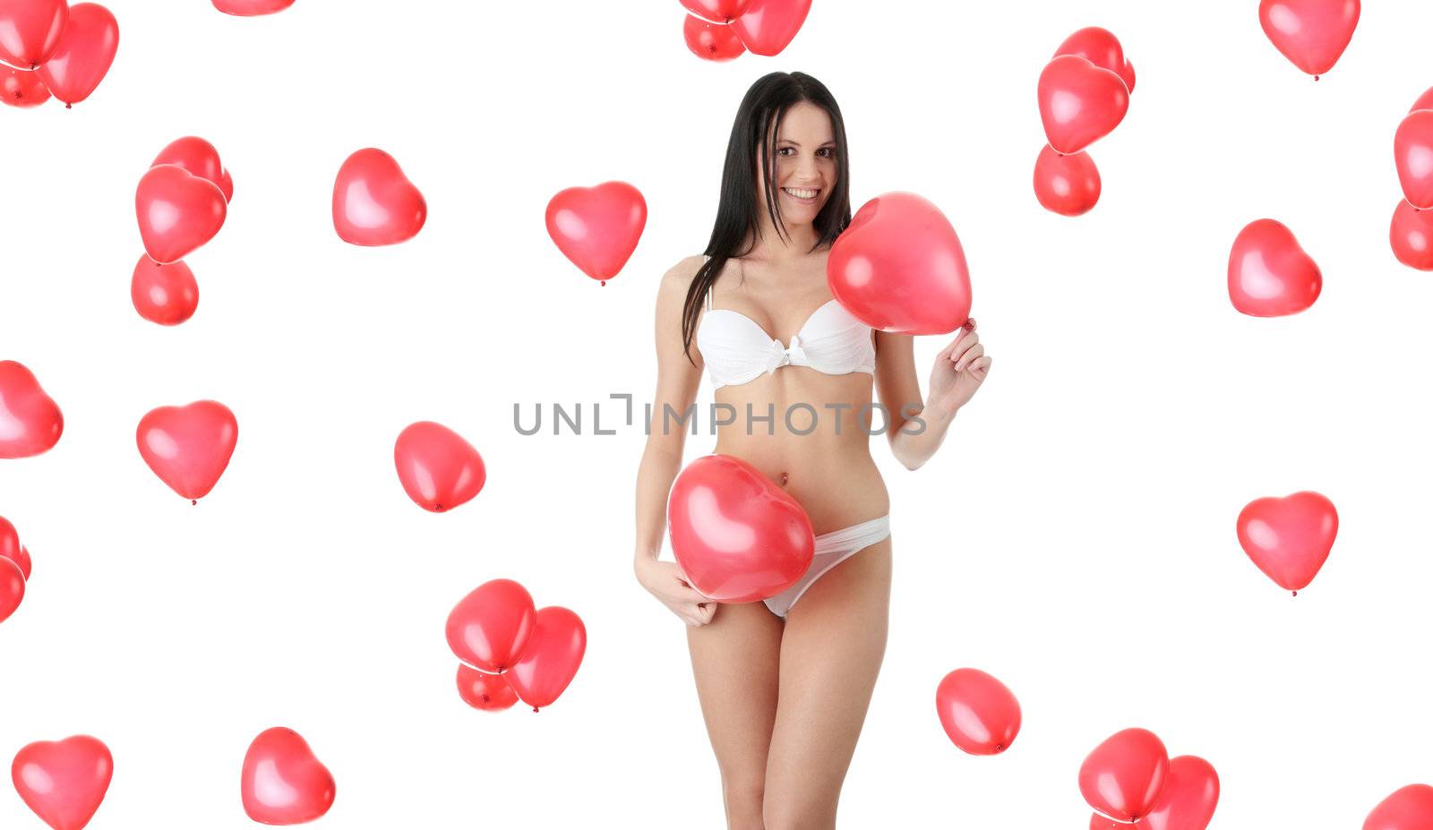 Beautiful young woman in lingerie with red heart balloon on a white background (love and valentines concept)