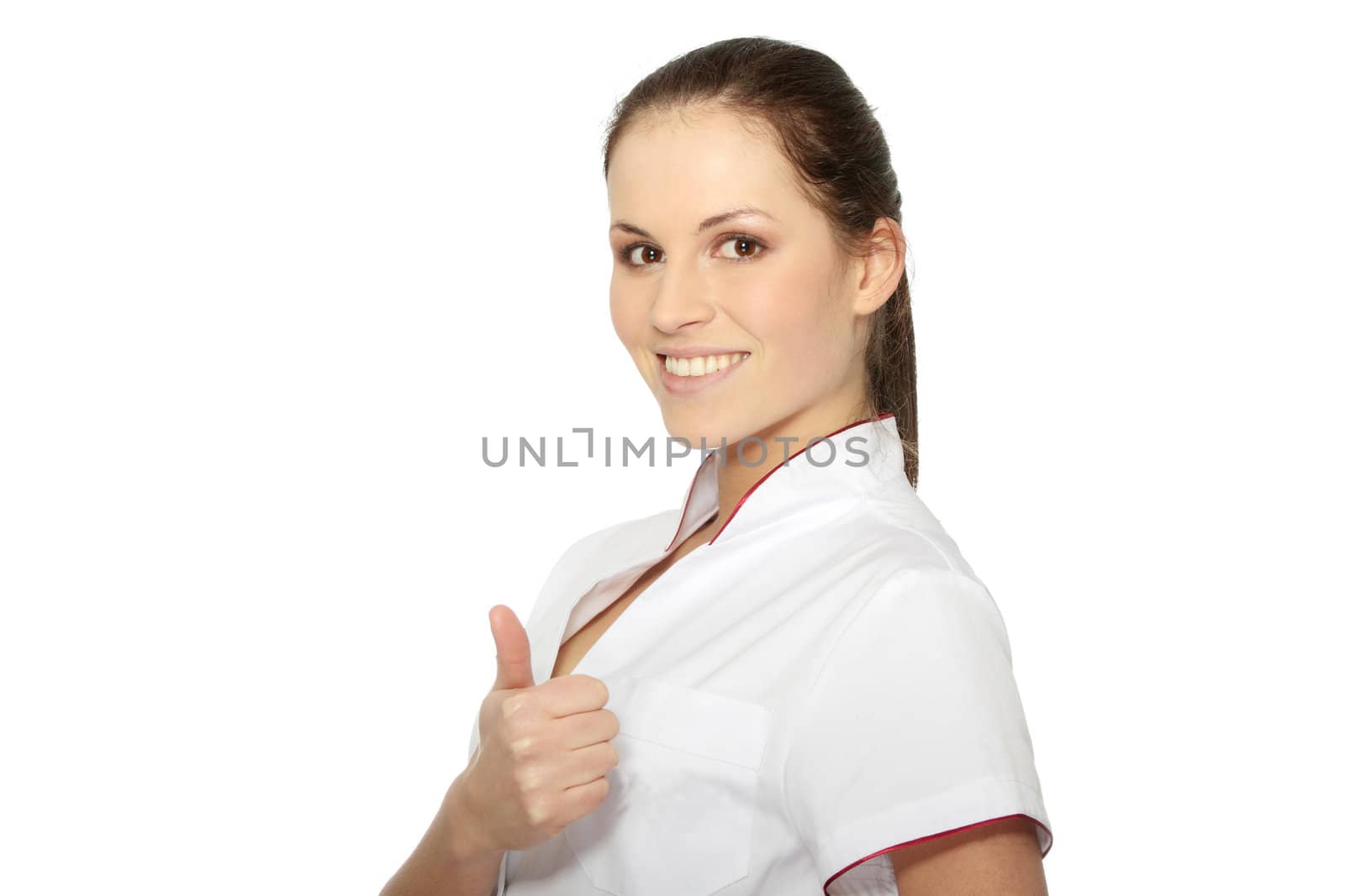 Young female doctor or nurse with thumb up, isolated on white background