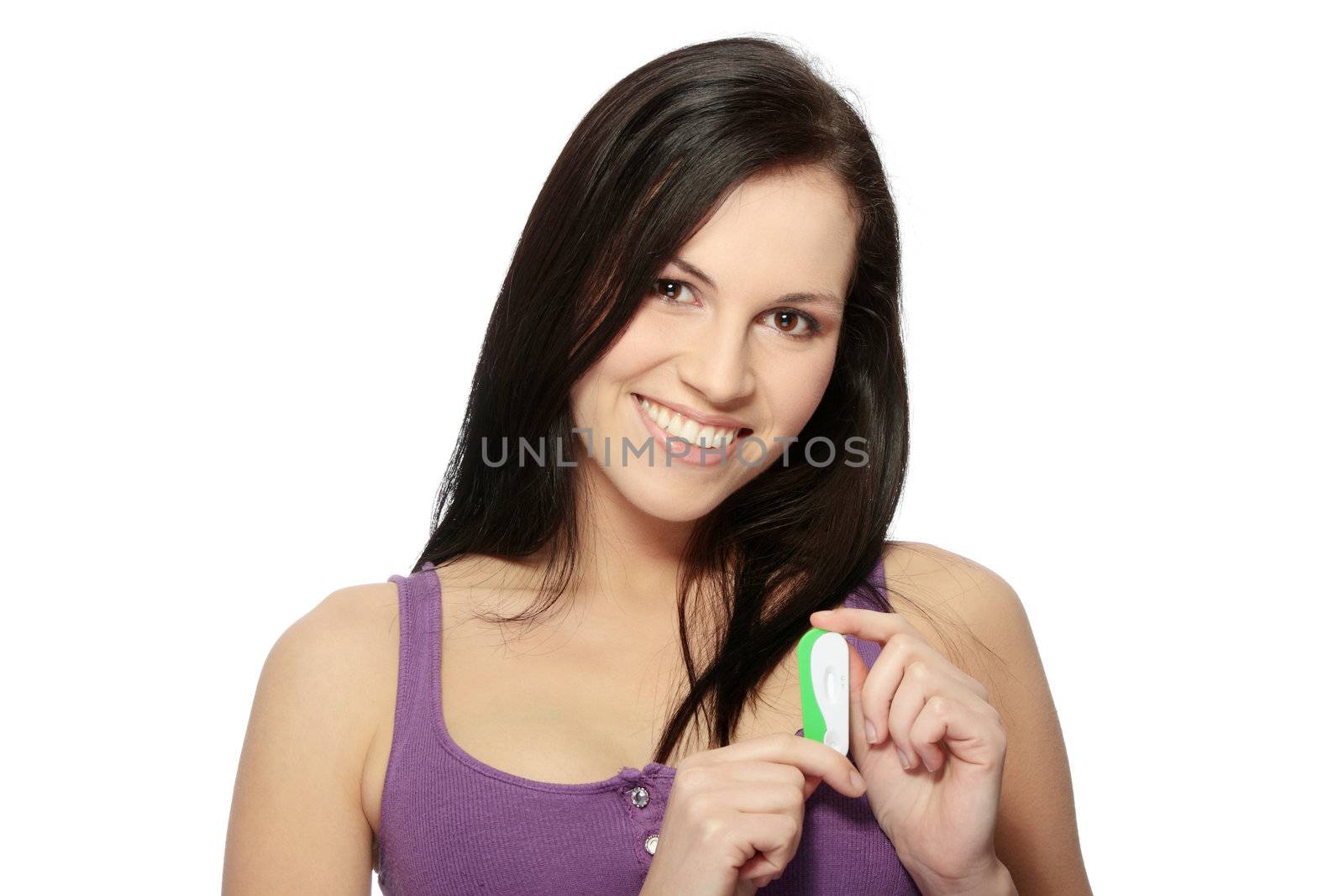 Smiling woman holding a pregnancy test, isolated on white