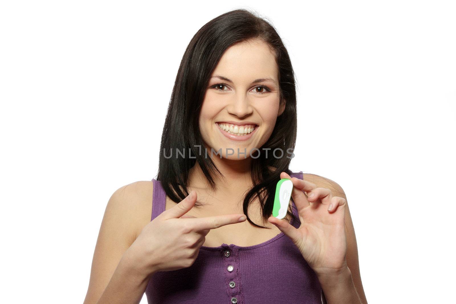 Smiling woman holding a pregnancy test, isolated on white