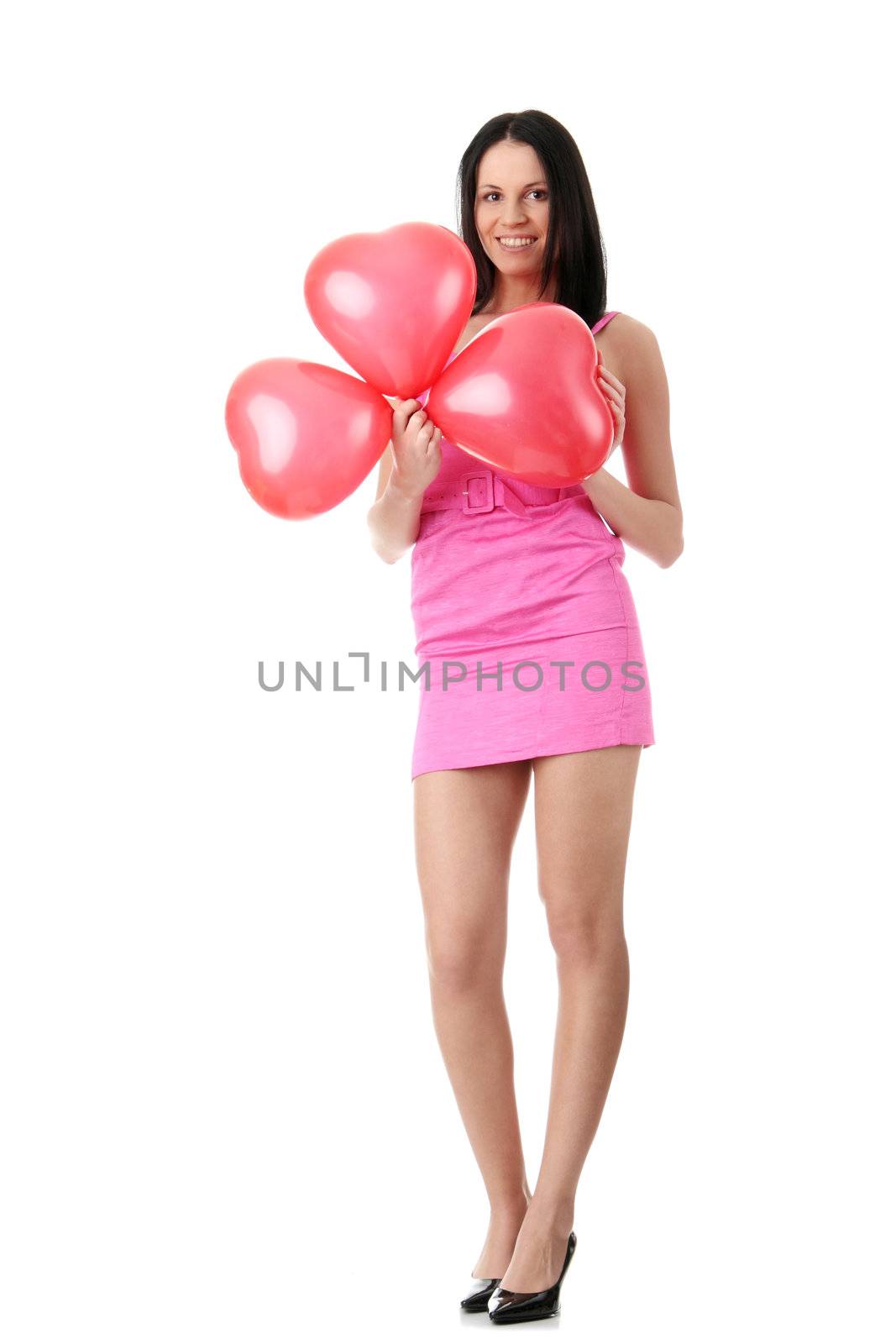 Young caucasian woman with heart shaped balloon