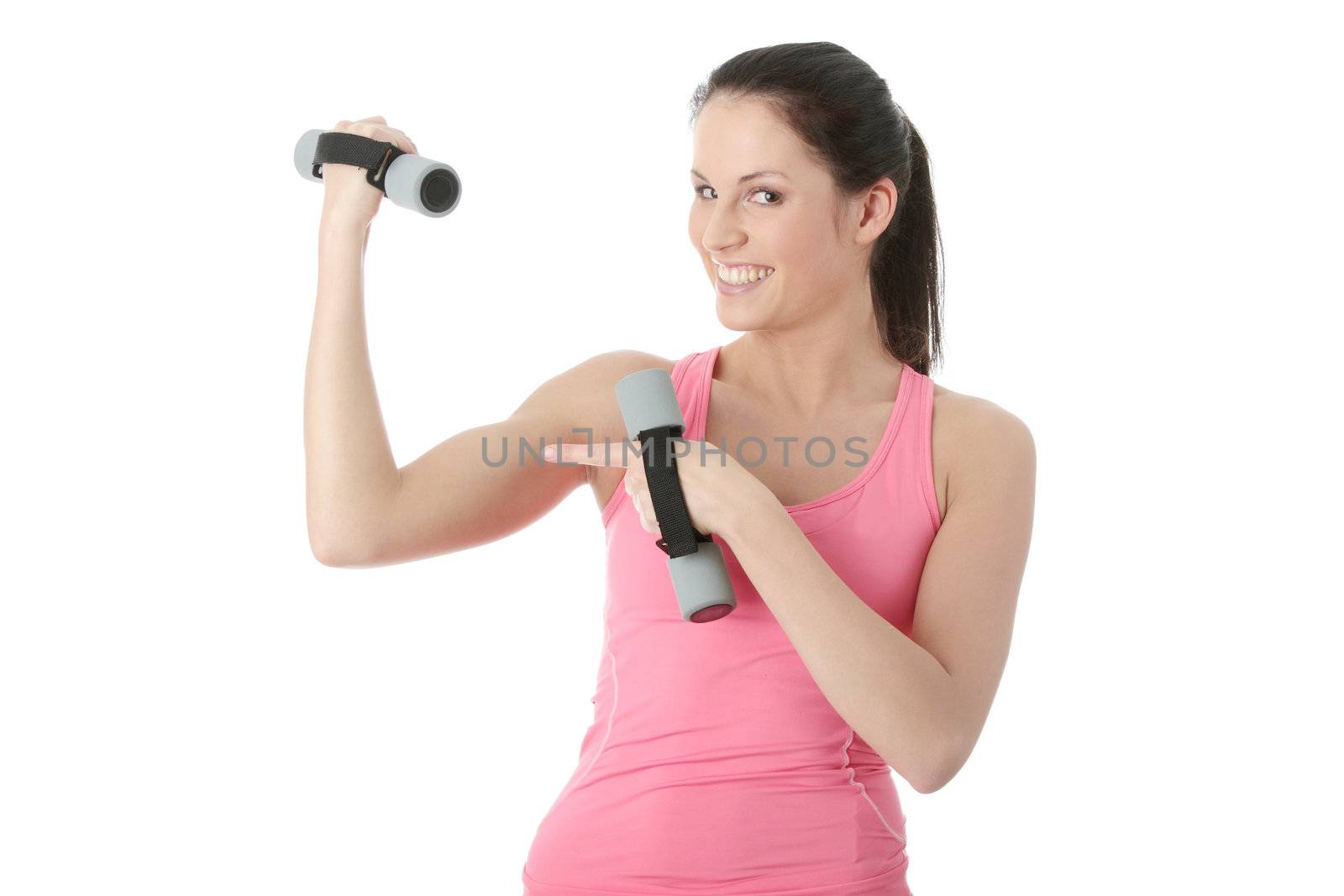 Beautiful young woman doing exercise with dumb bells , isolated