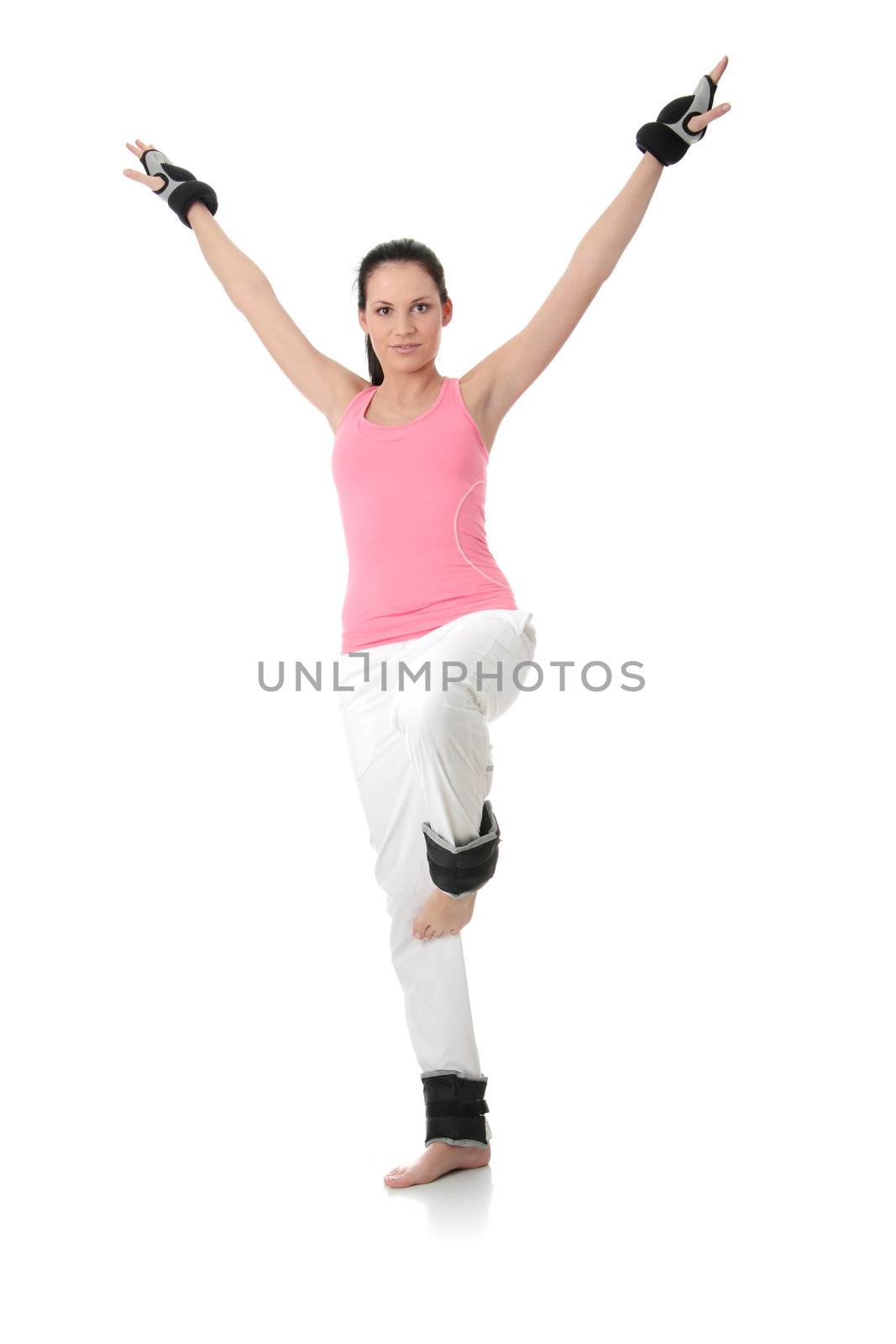 Beautiful young woman doing exercise with dumb bells , isolated