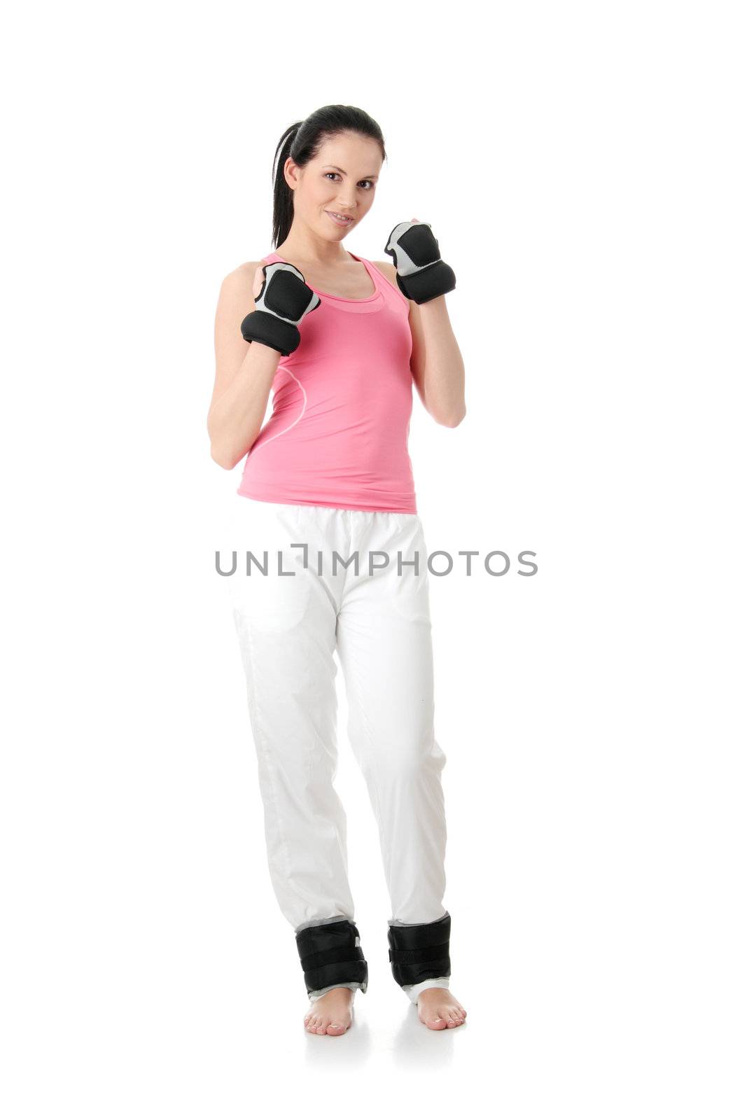 Beautiful young woman doing exercise with dumb bells , isolated