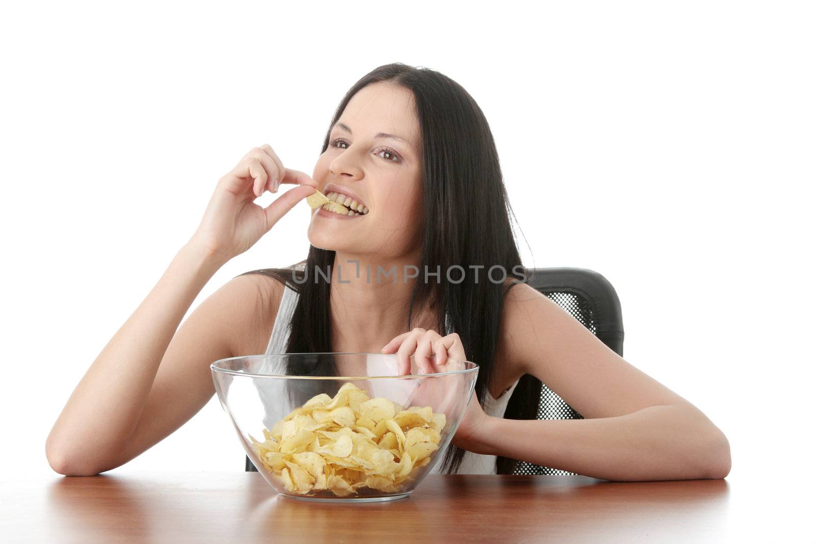 Young beautiful woman eating chips, isolated on white