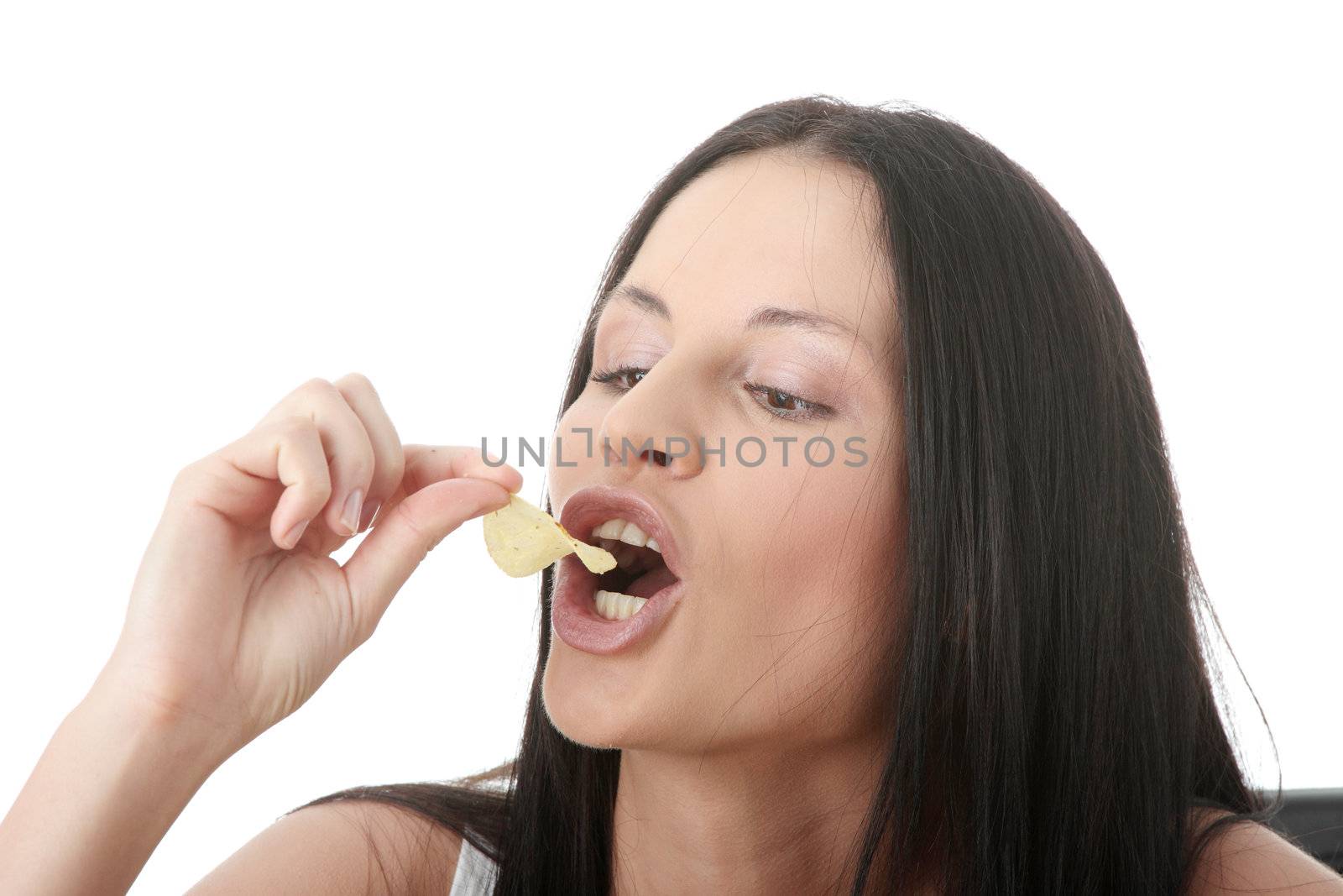 Young beautiful woman eating chips, isolated on white