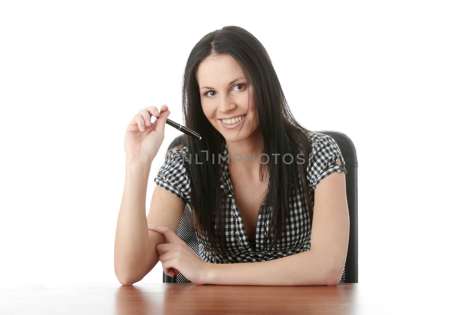 Businesswoman behind a desk, isolated on white