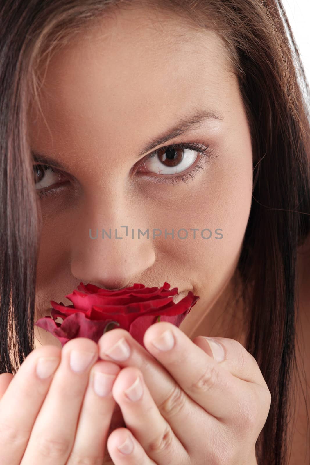 Studio portrait of sensual beautiful woman with rose