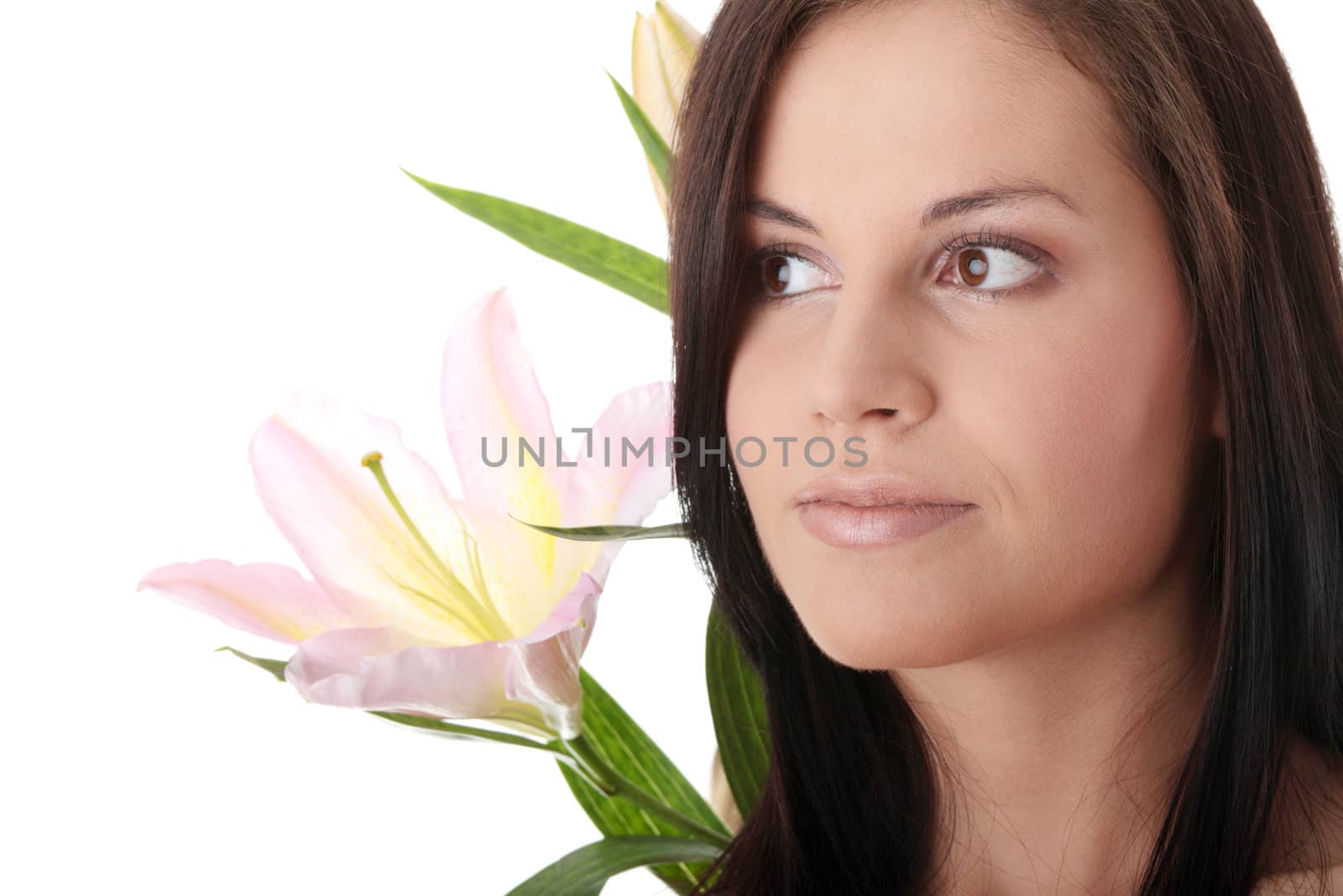 Beautiful young woman with lily flower. Isolated