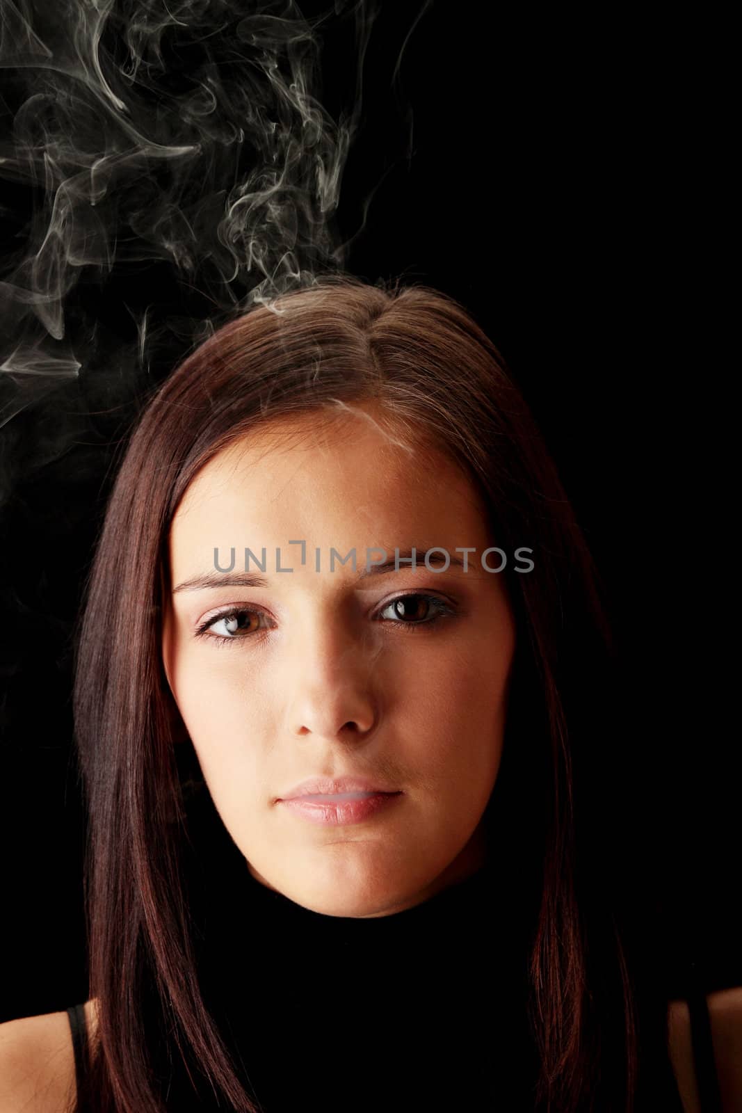 Young woman smoking by BDS