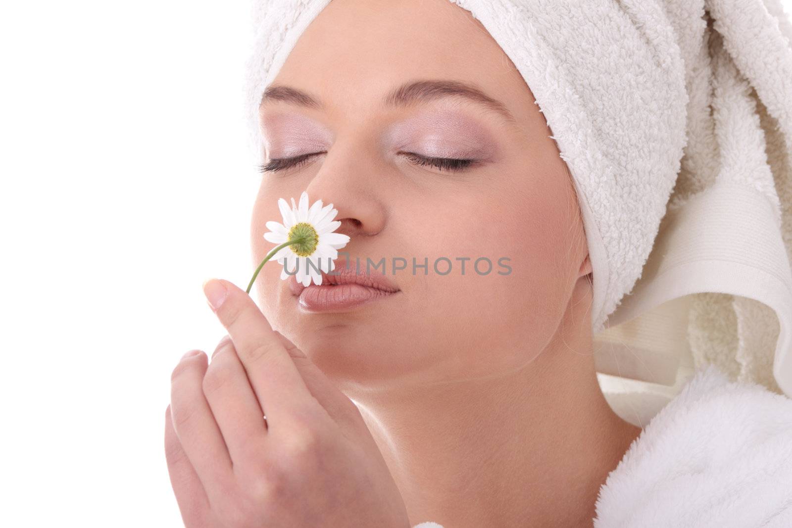 Portrait of young beautiful woman wearing bathrobe, isolated on white
