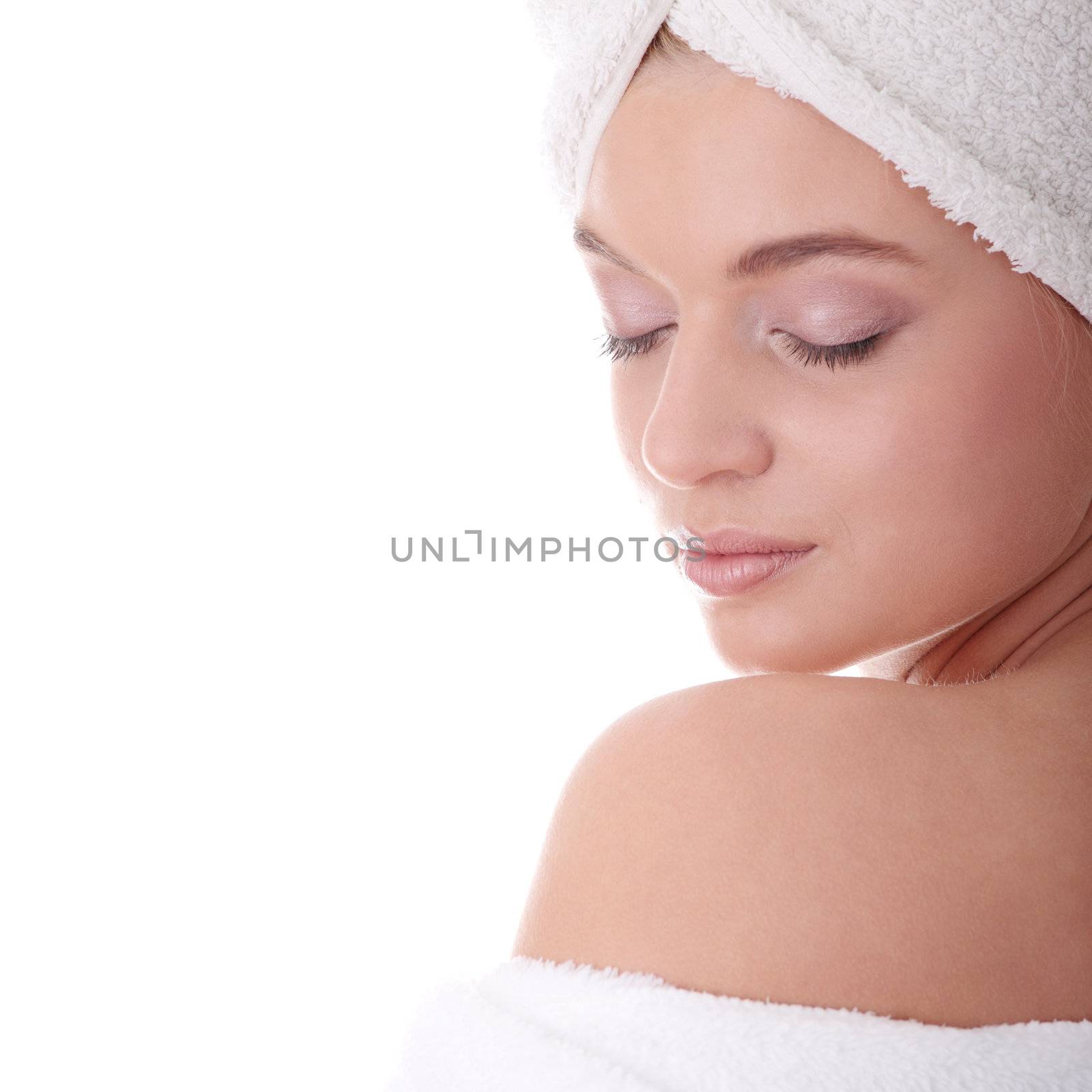 Portrait of young beautiful woman wearing bathrobe, isolated on white