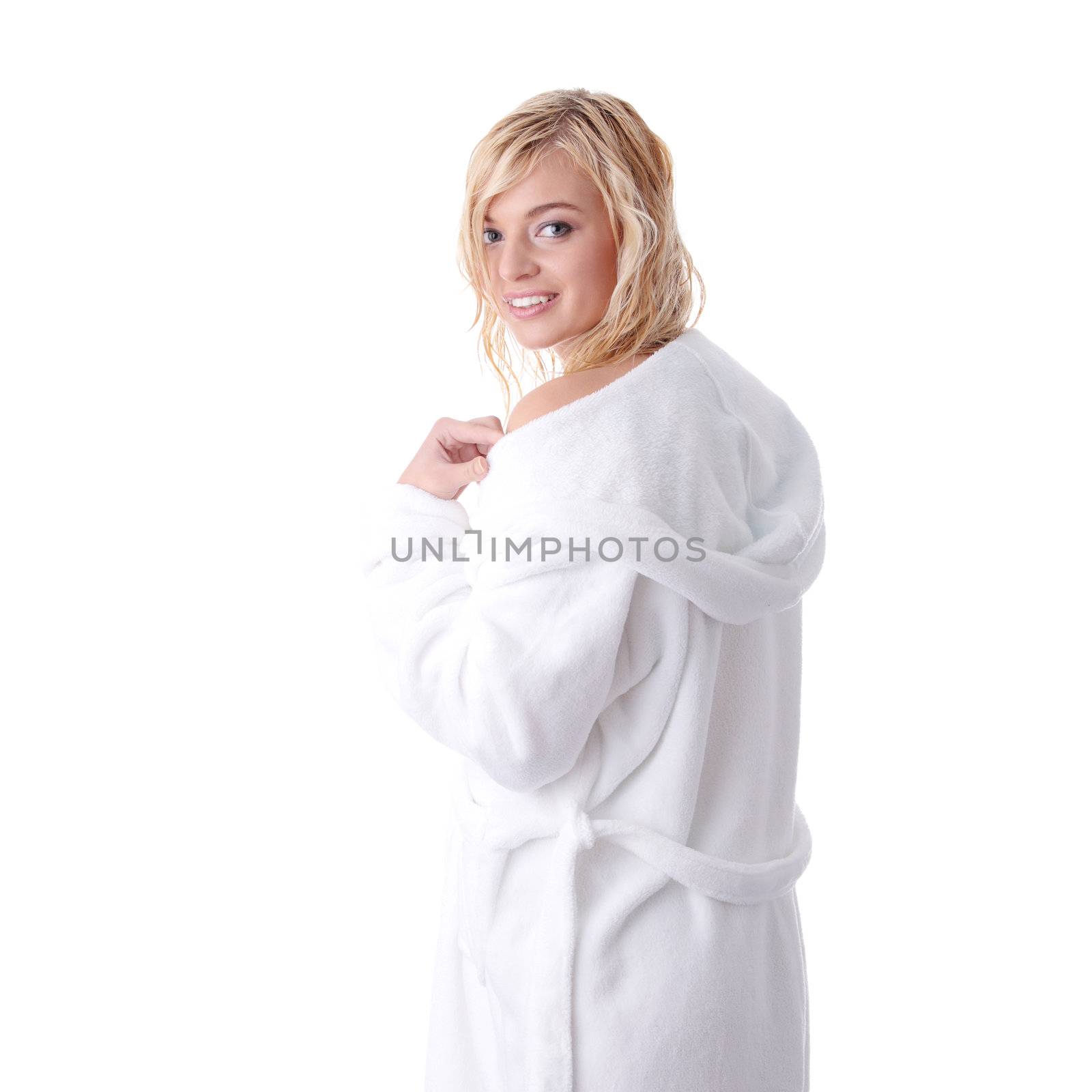 Young beautiful blond teen woman dressed in white bathrobe