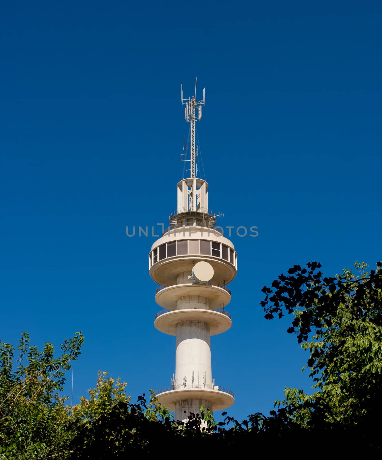 Communications tower with a beautiful blue sky