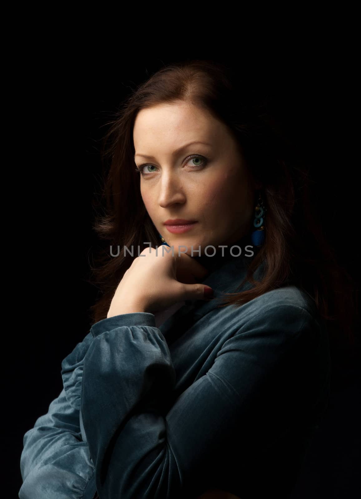Lady looking to you - stodio portrait over dark background
