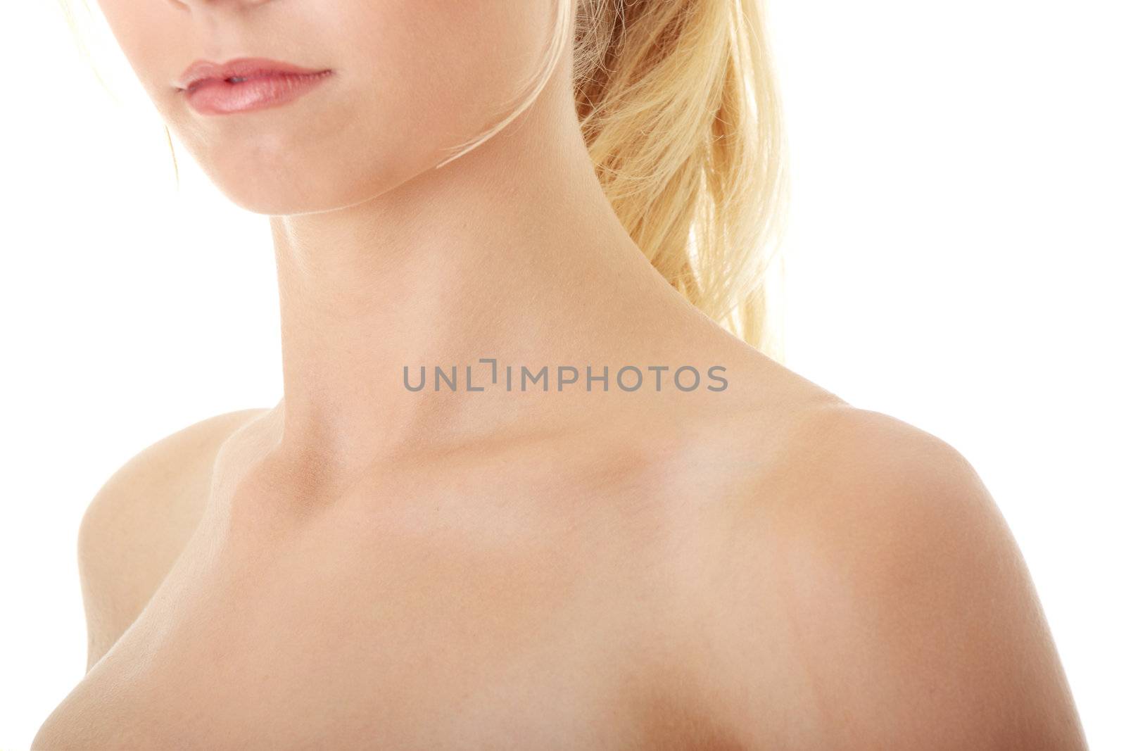 Neck and shoulder of a beautiful girl isolated on white background