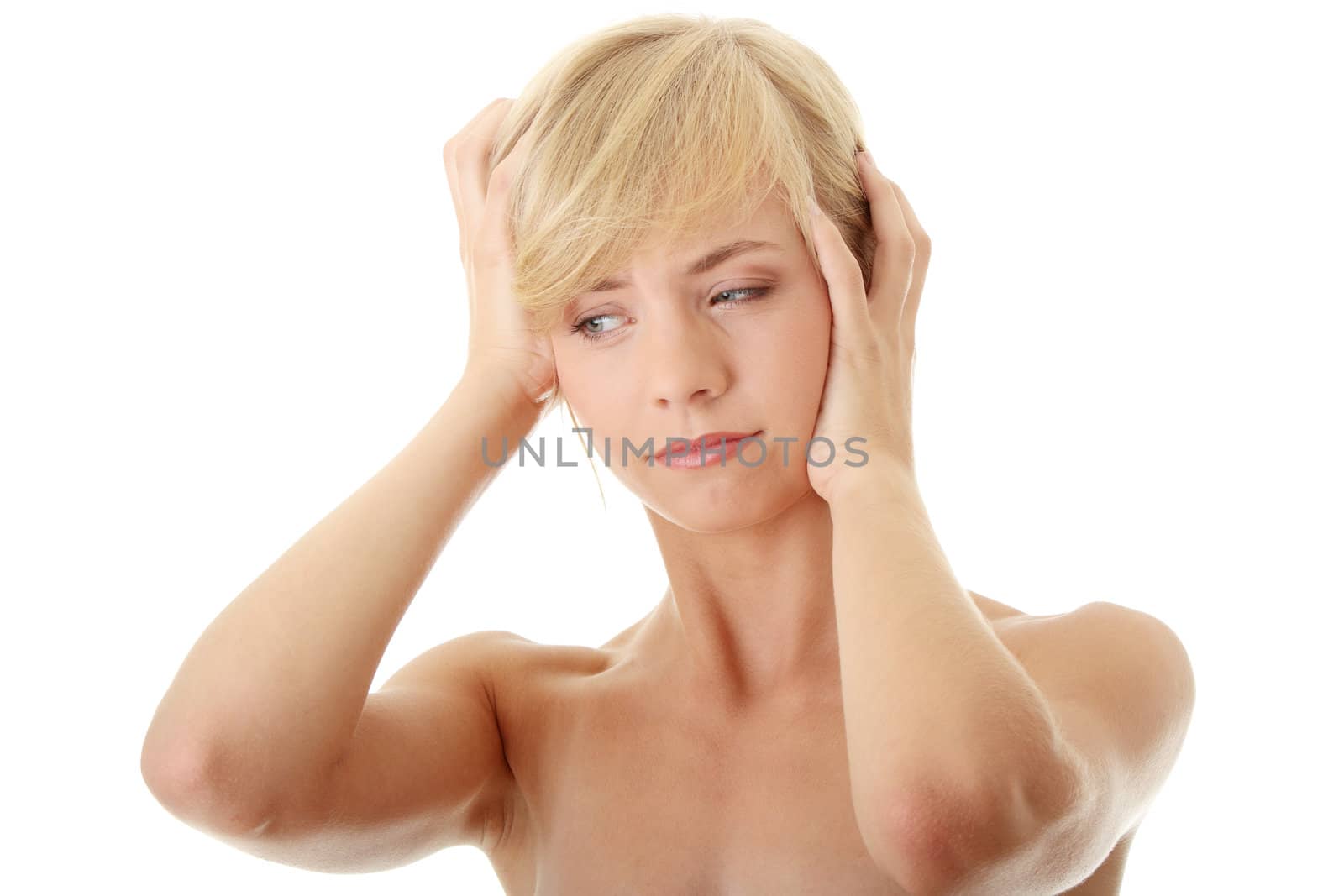 Woman with headache holding her hands to the head, isolated on white