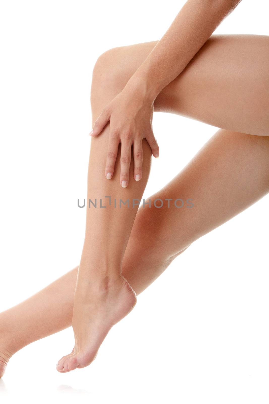 Long pretty woman legs isolated on white