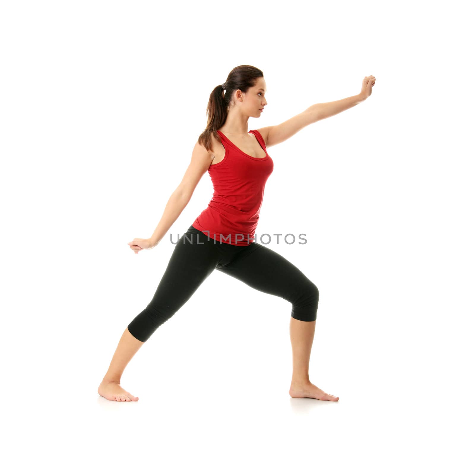 Young woman doing yoga exercise by BDS