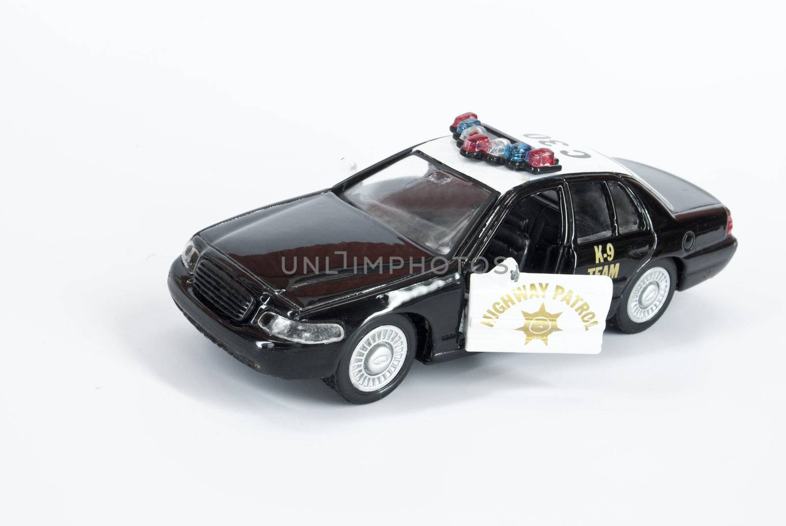 An old 	toy police car k-9 team