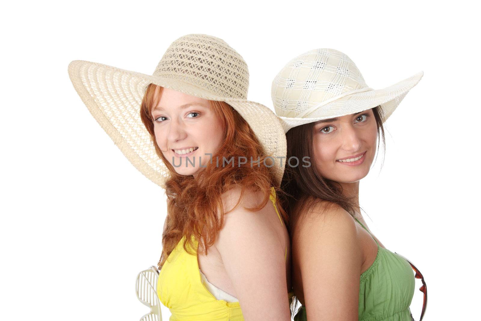 Two girlfriends in summer dress and hat over white background