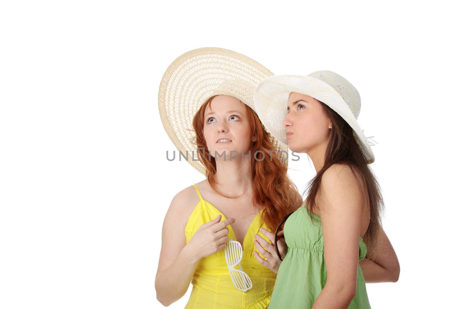 Two girlfriends in summer dress and hat over white background