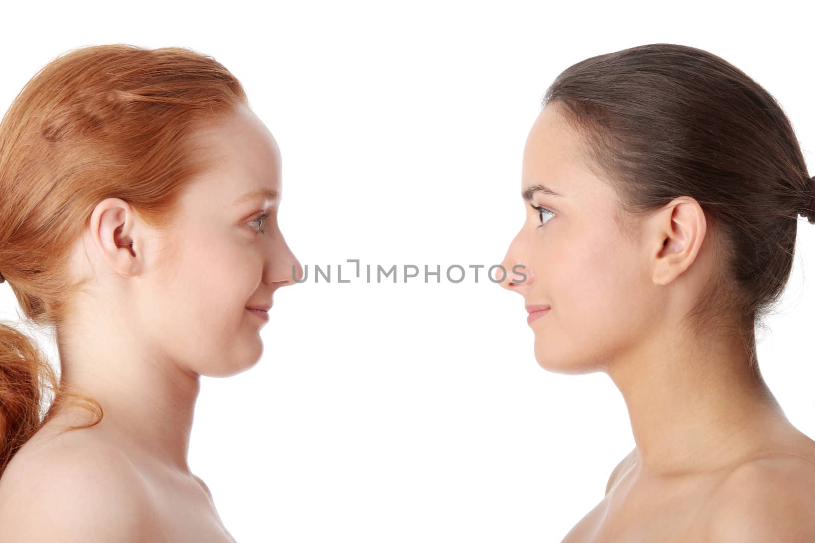 Spa - portrait of two woman - redhead and brunette - isolated on white background