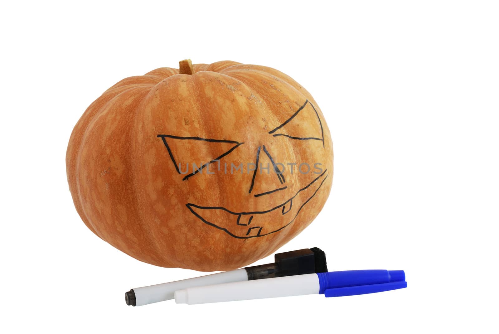 Halloween jack o lantern preparation - pumpkin with drawn pattern isolated on white background
