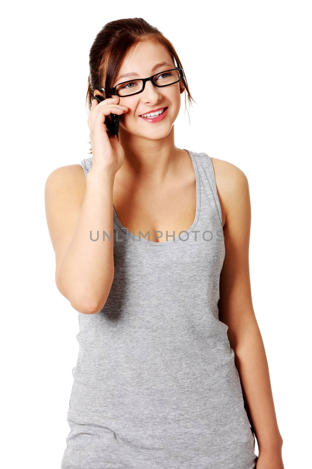 Young caucasian beautiful girl talking by telephone and smiling.