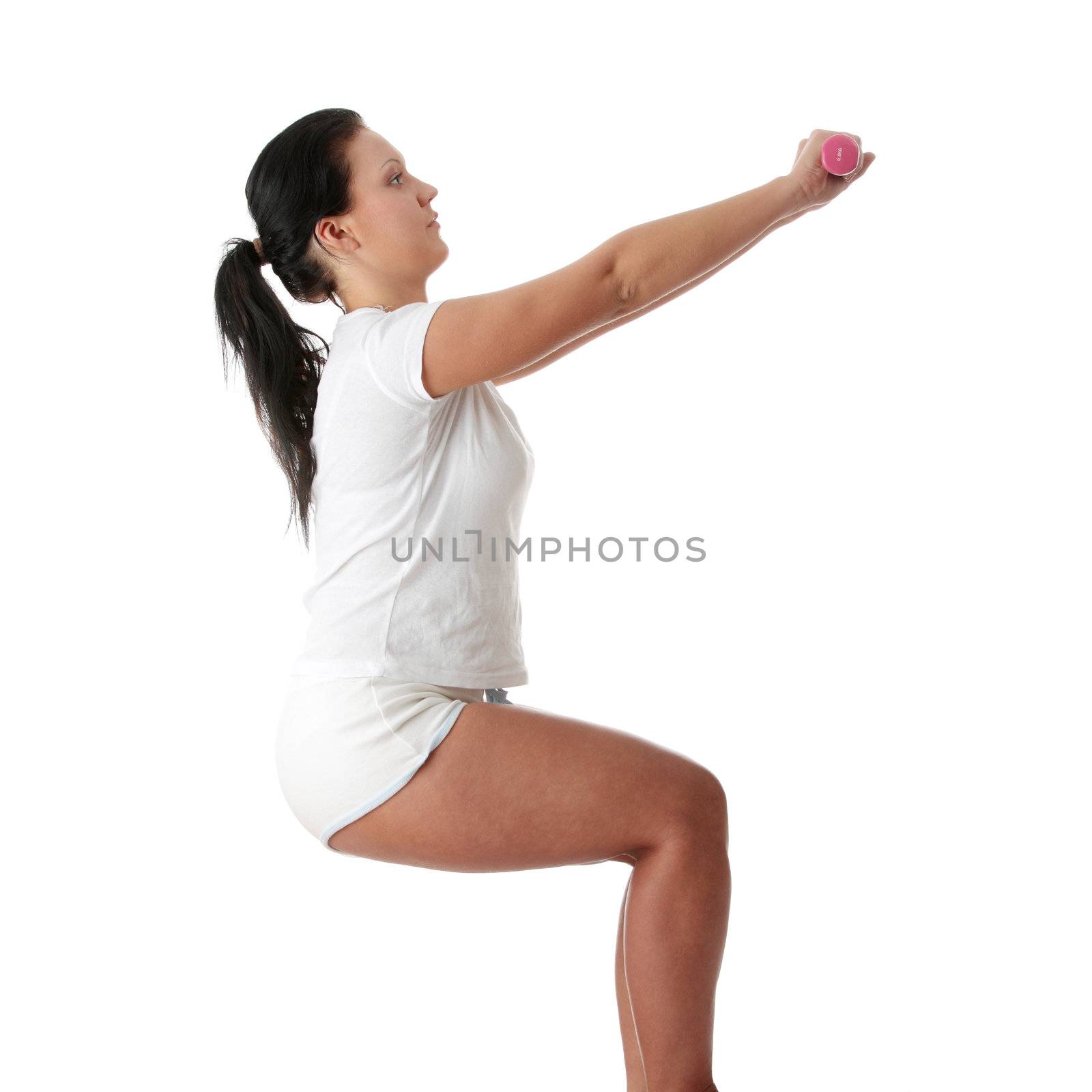 Young happy woman doing fitness exercises