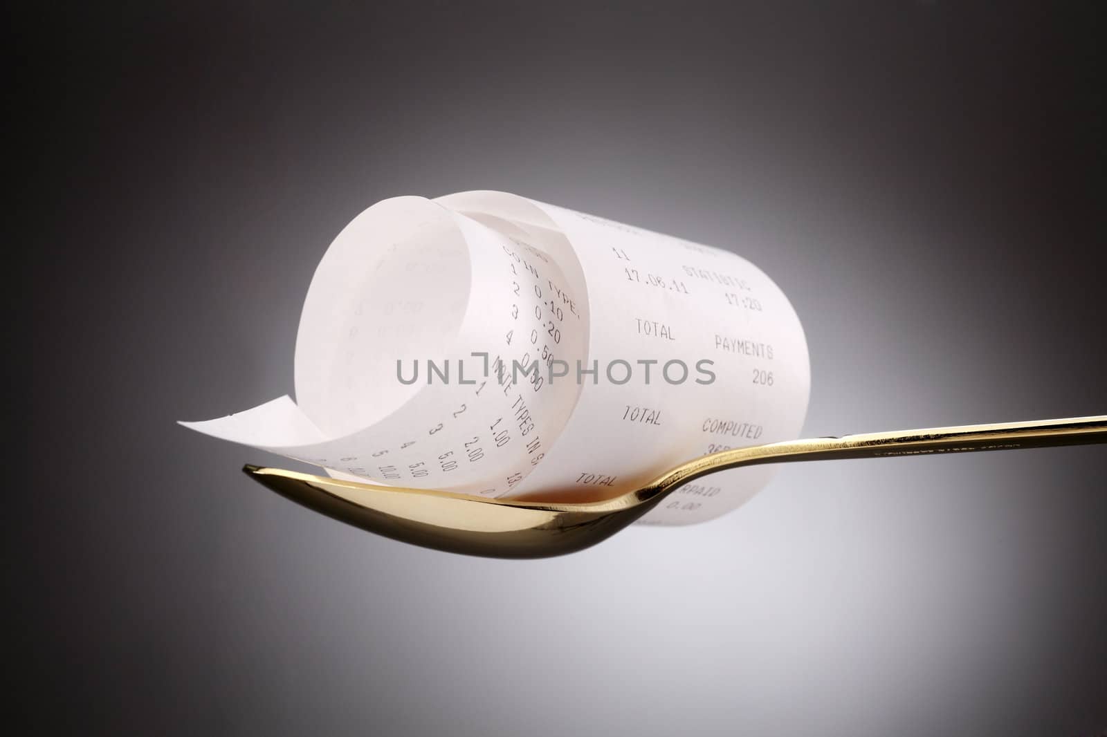 stock image of the receipt on golden spoon
