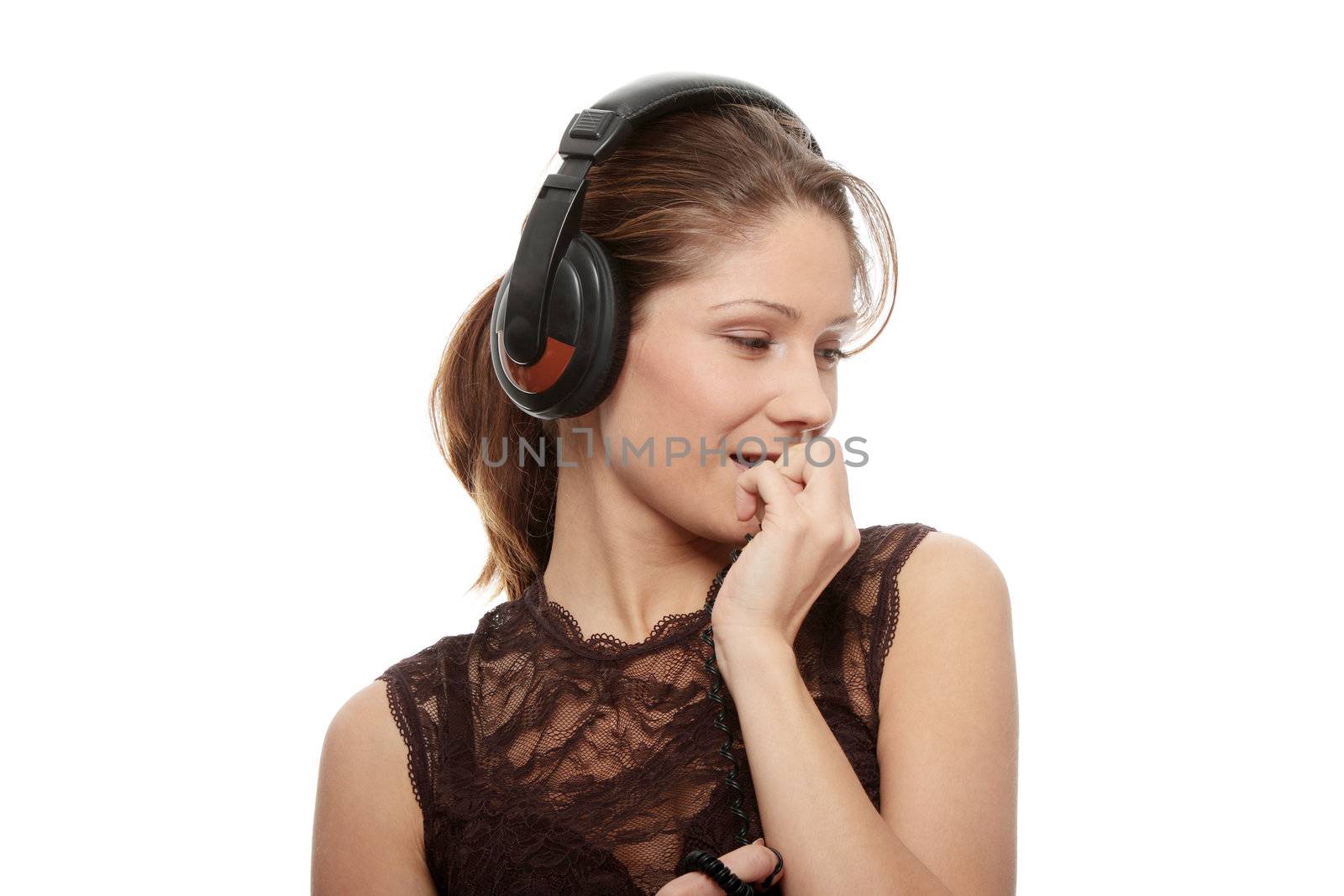 Listening to the Music, young caucasian beautiful woman with headphones, isolated on white background