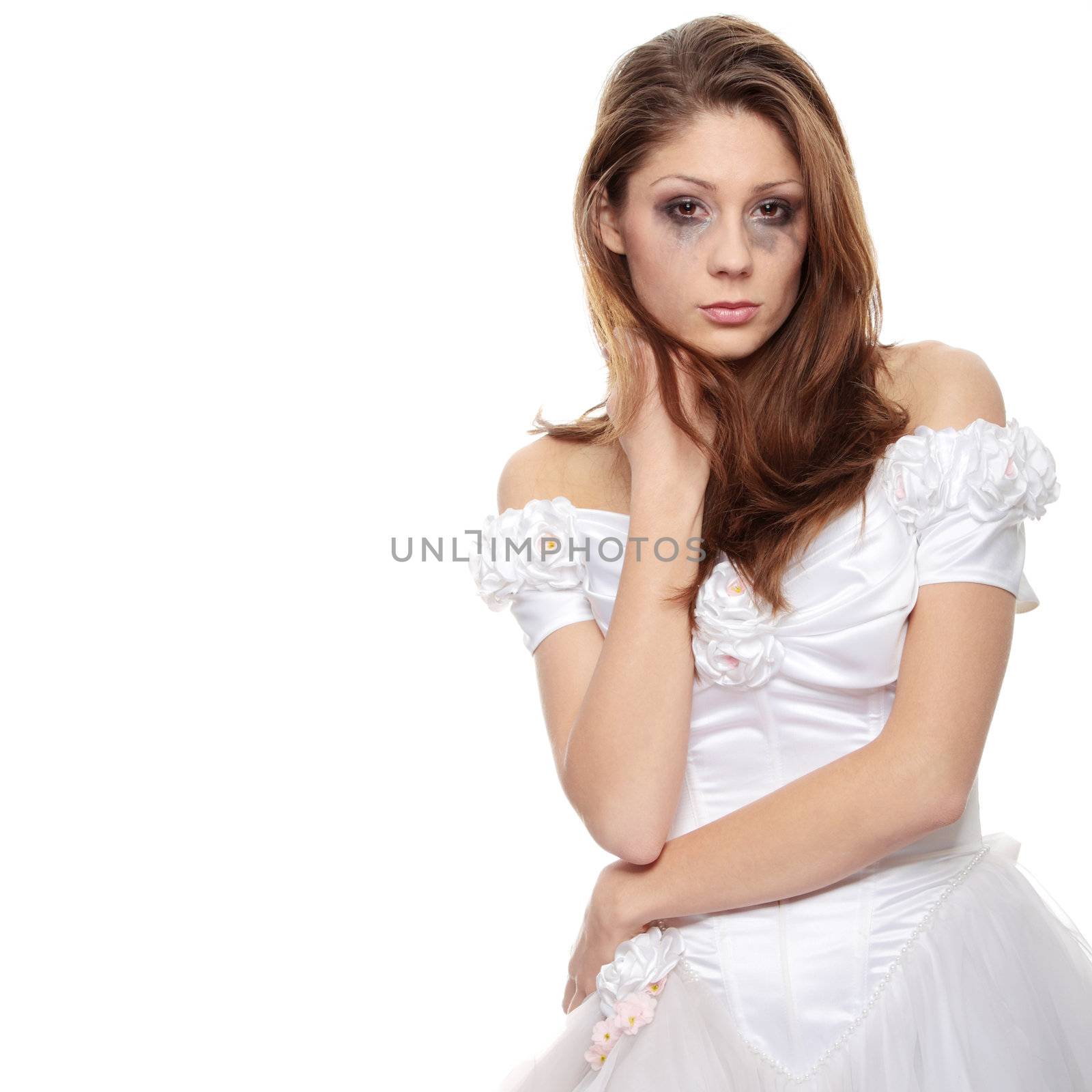 Beautiful young caucasian sad bride crying, over white background