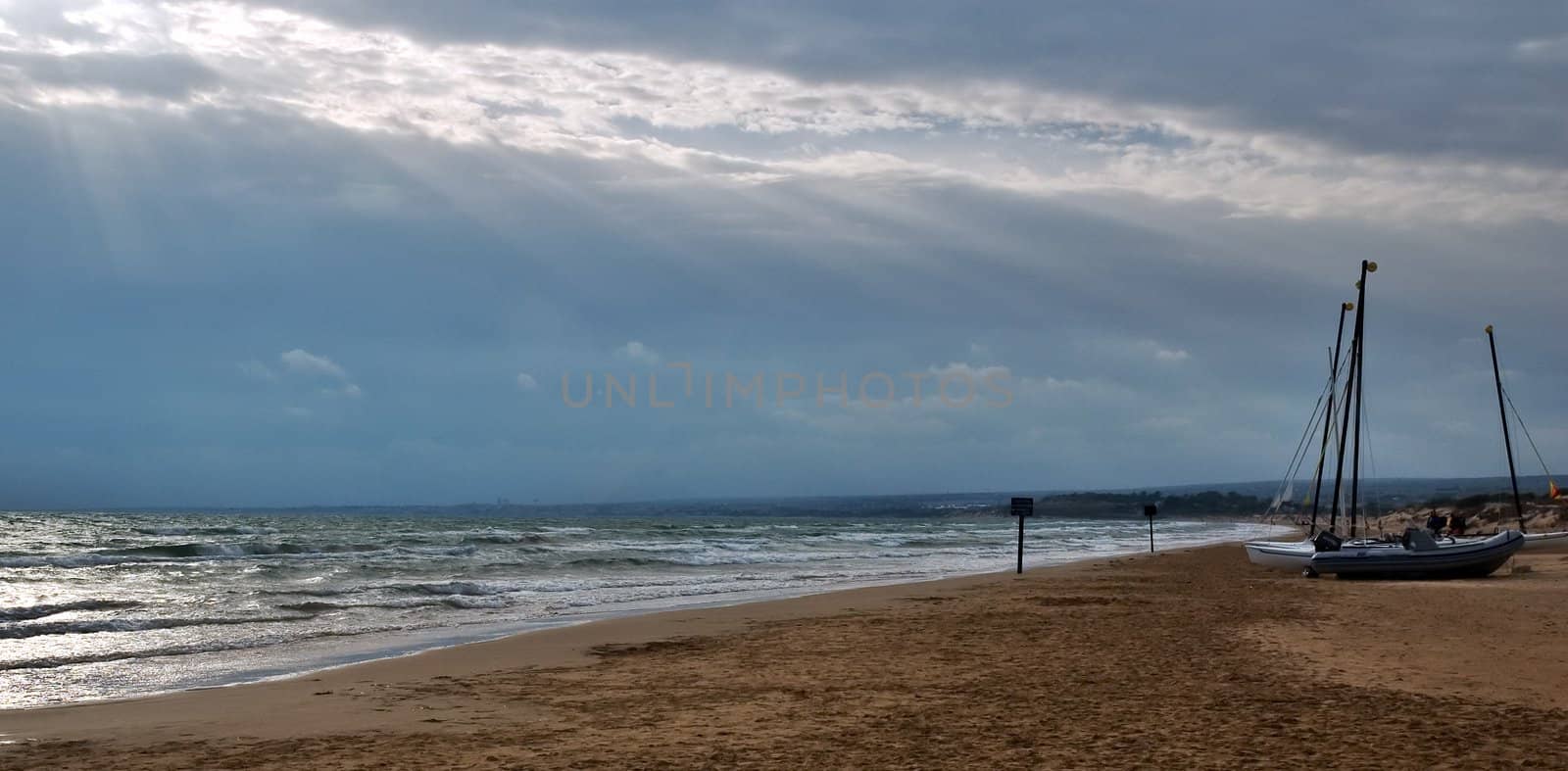 Beach view with boats by sil