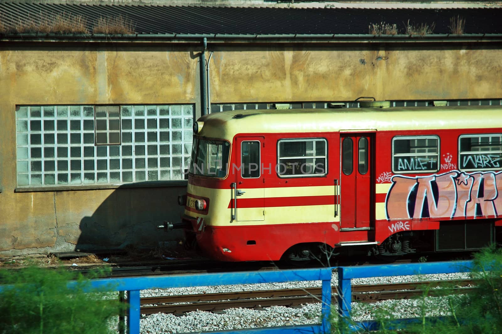 Red train locomotive with graffiti