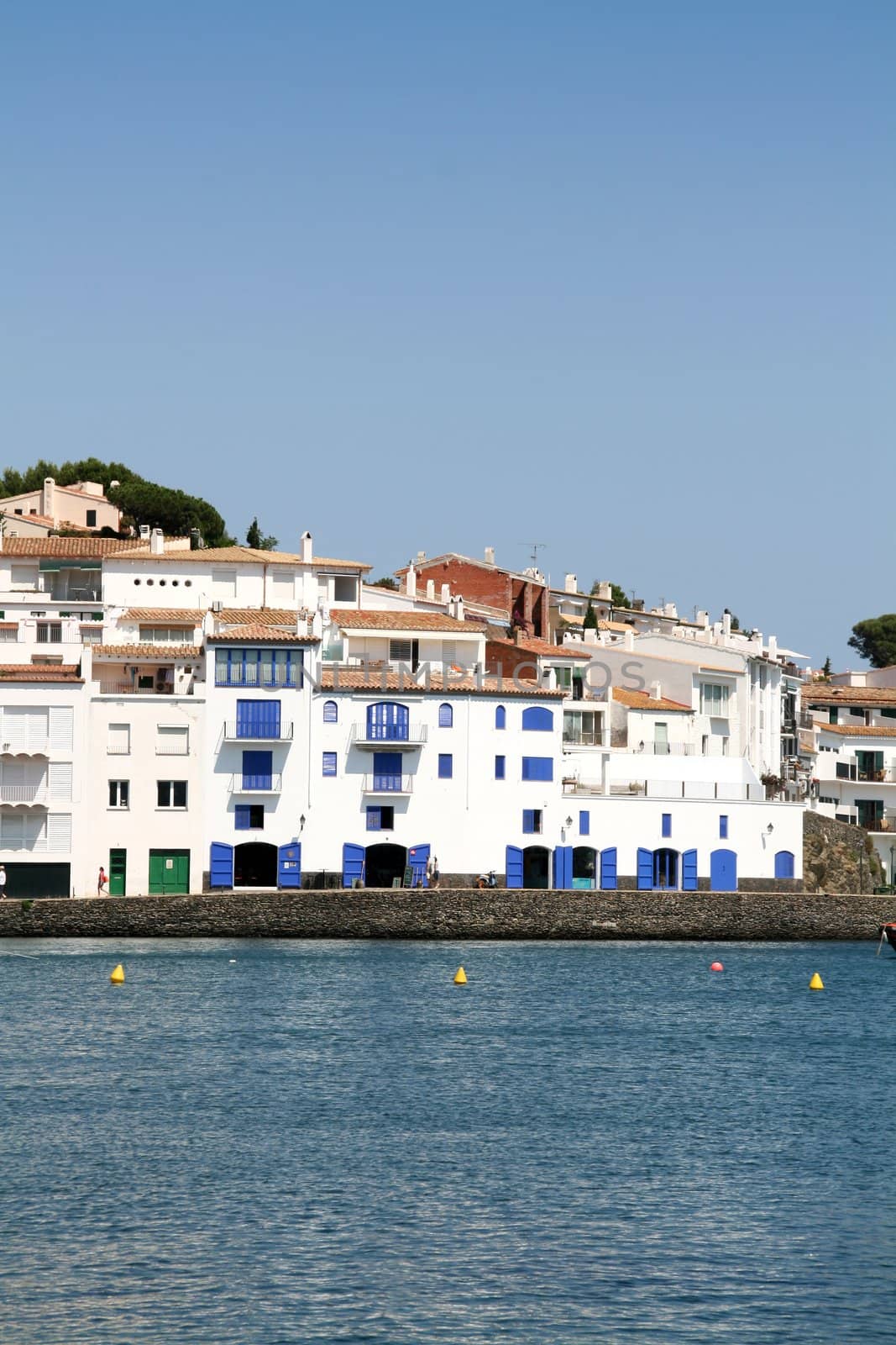 typical mediterranean village, white houses at the coast