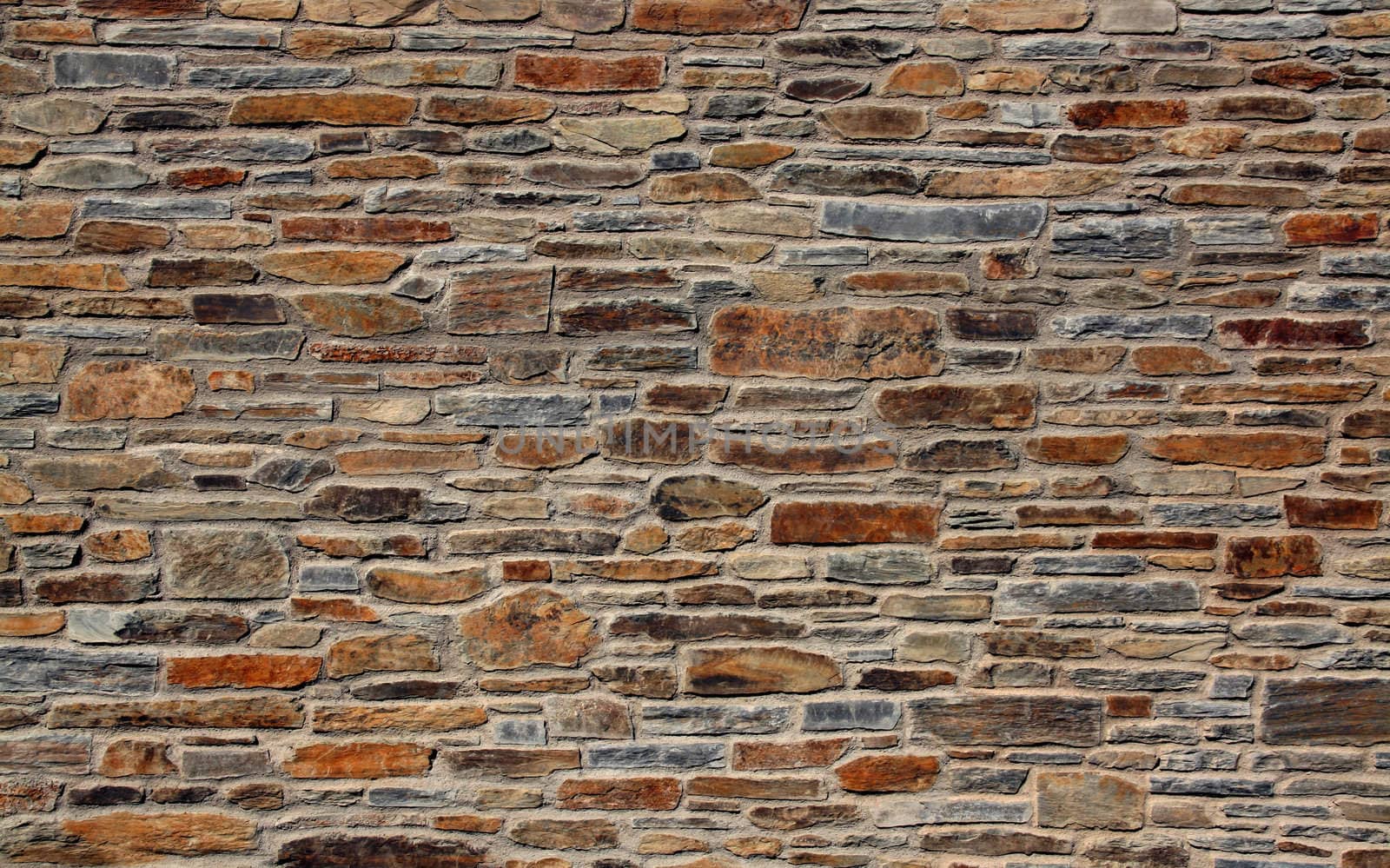 stone wall of a mediterranean town, background texture