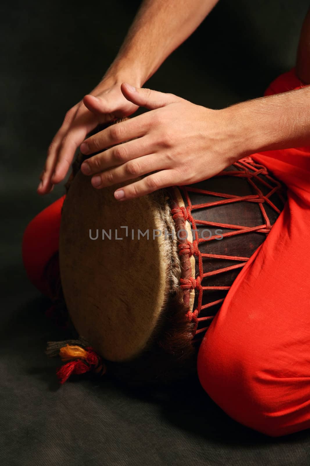 Man playing the nigerian drum in studio