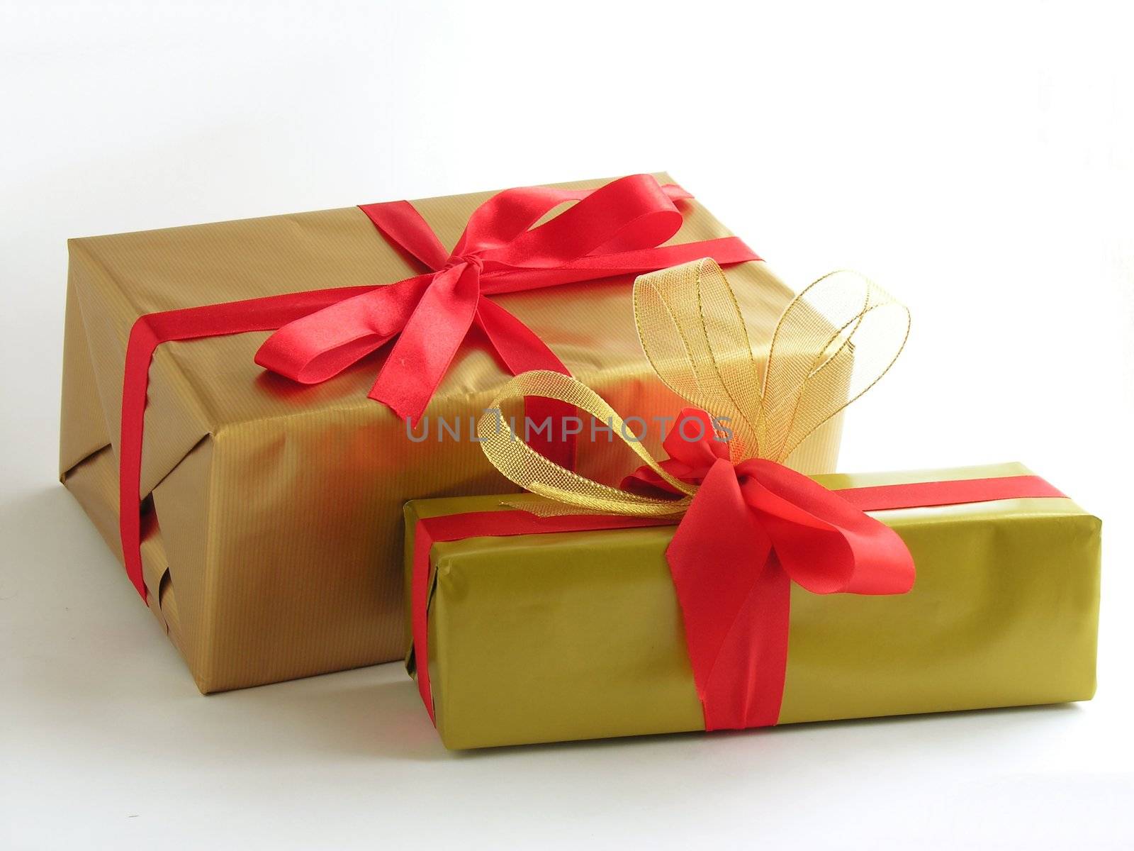 Christmas gifts in gold paper by RAIMA
