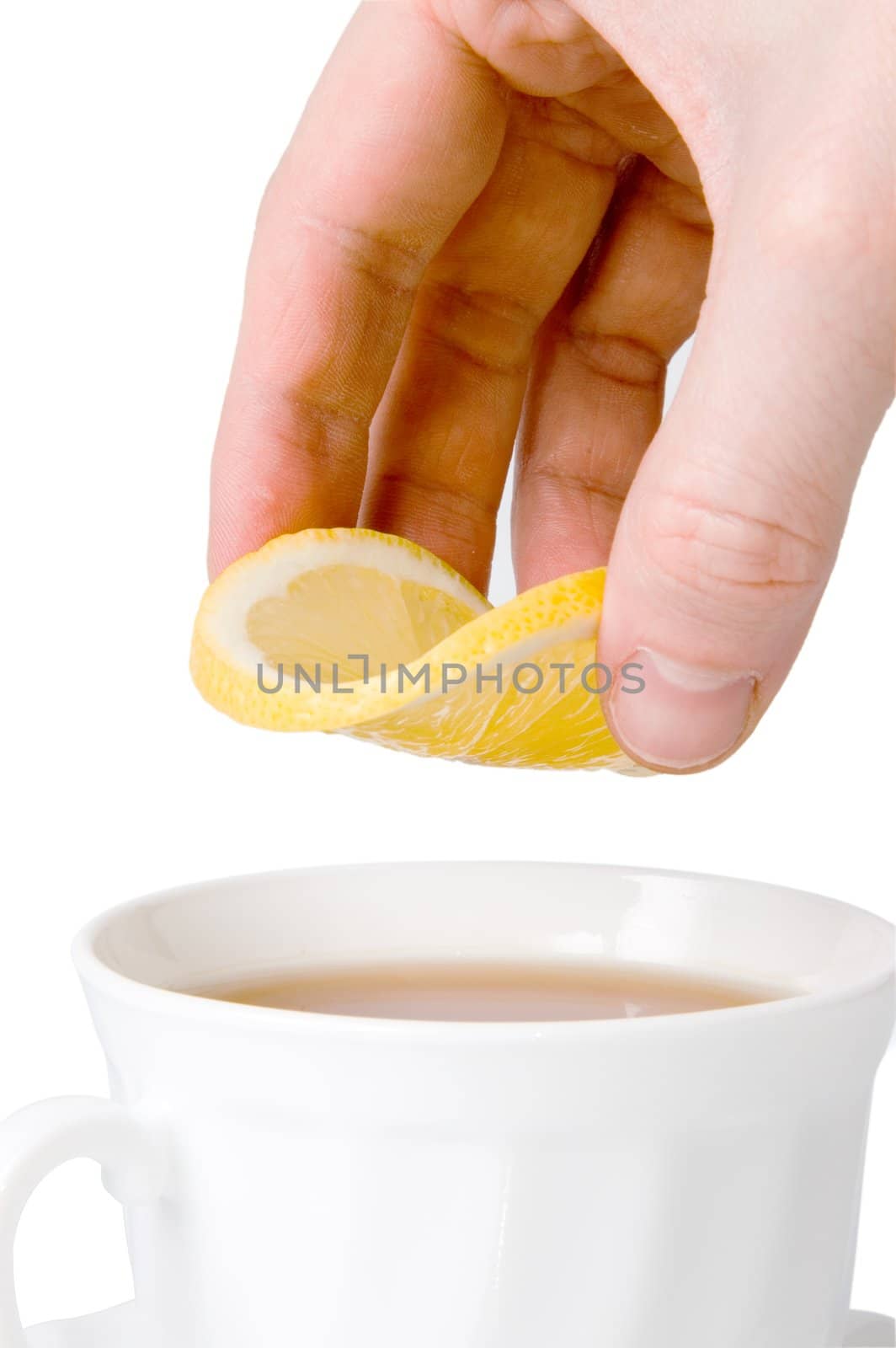 White tea cup and slice of lemon