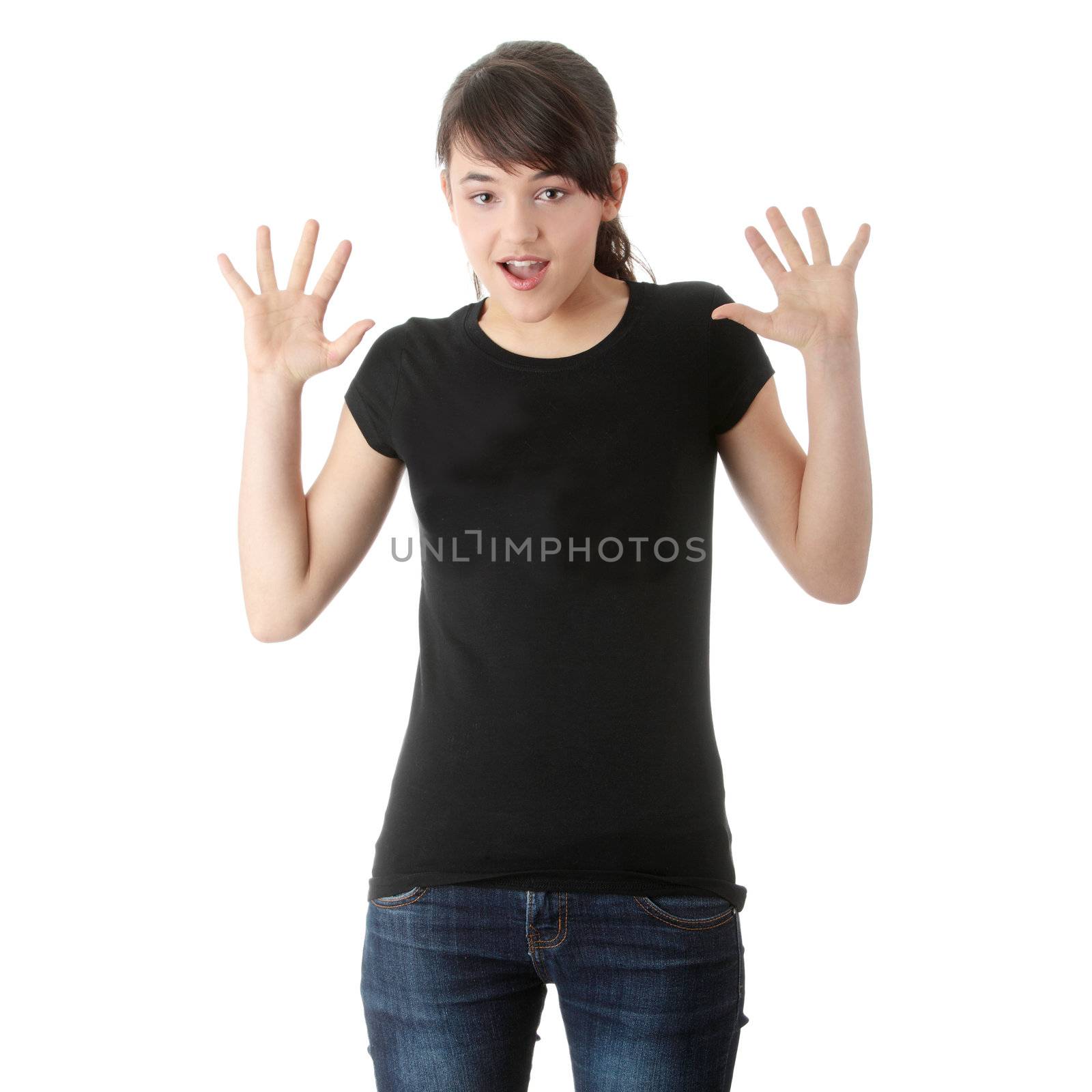Teen girl with hands up portrait, over white background