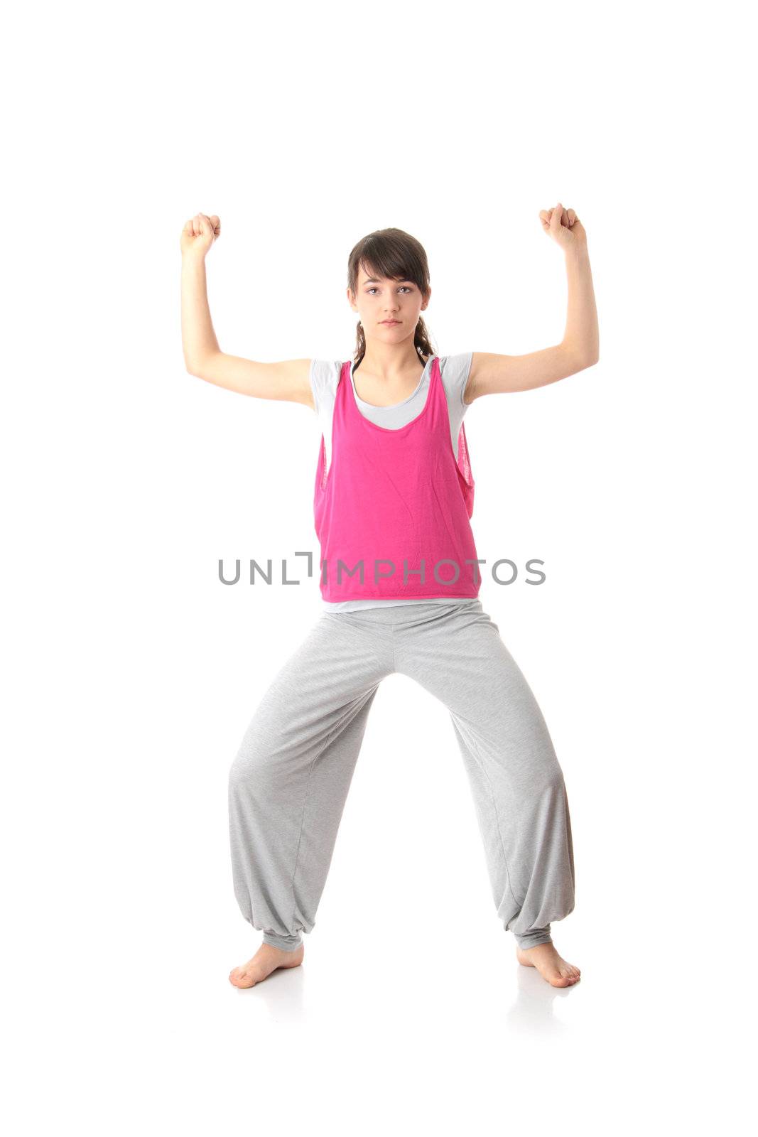 Teen woman training yoga, isolated on white