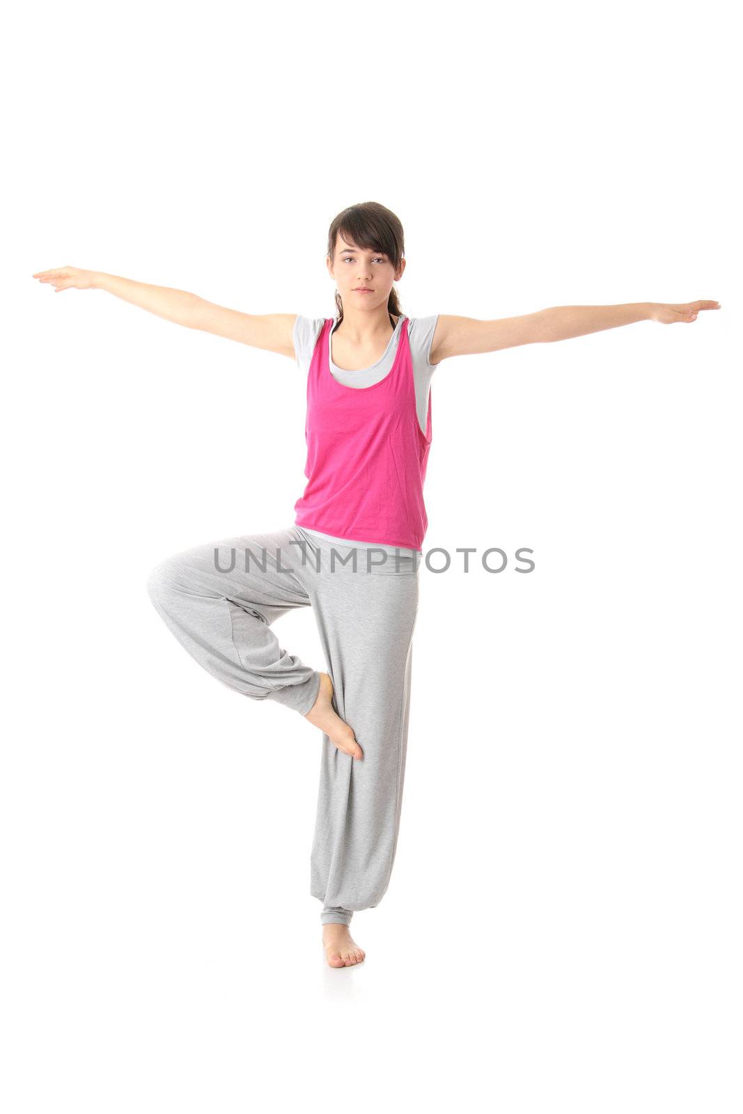 Teen woman training yoga, isolated on white