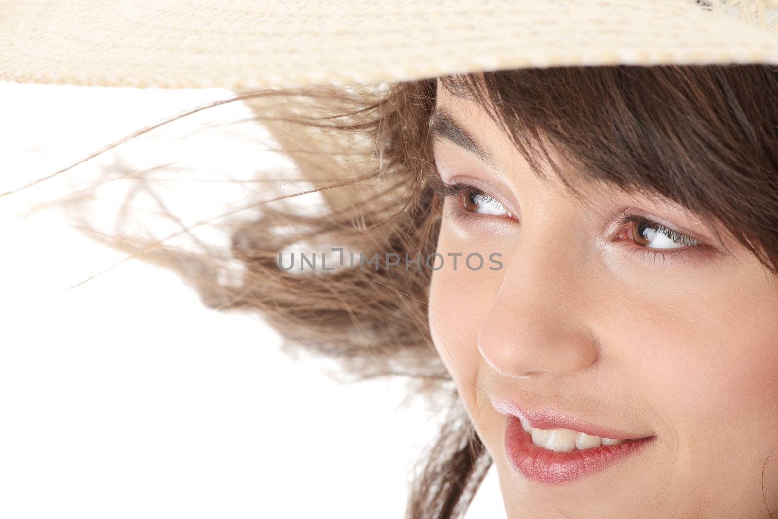 Happy teen girl in dress and summer hat, over white background