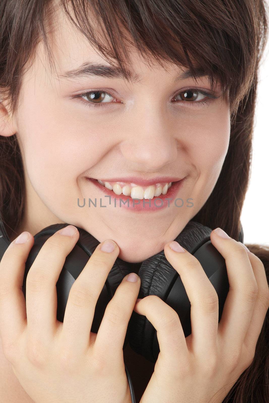 Young beautiful happy women listening music in headphones