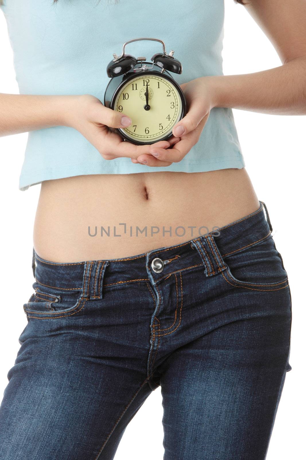 A teen woman with alarm clock isolated on white background